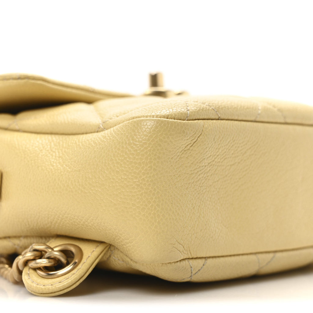 Chanel Shiny Caviar Quilted Chain Melody Backpack Yellow