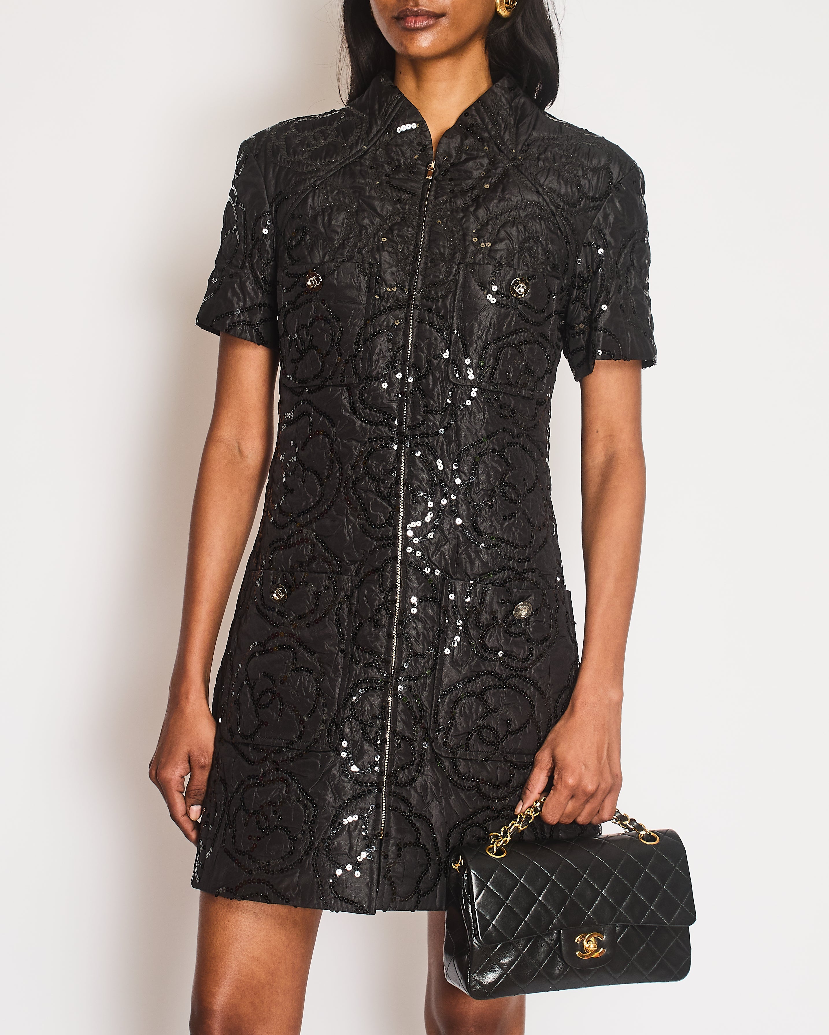 Chanel Black Padded Short-Sleeved Mini Dress with Sequin Camellia Embroideries and Front Pockets with Crystal CC Logo Buttons Size FR 38 (UK 10