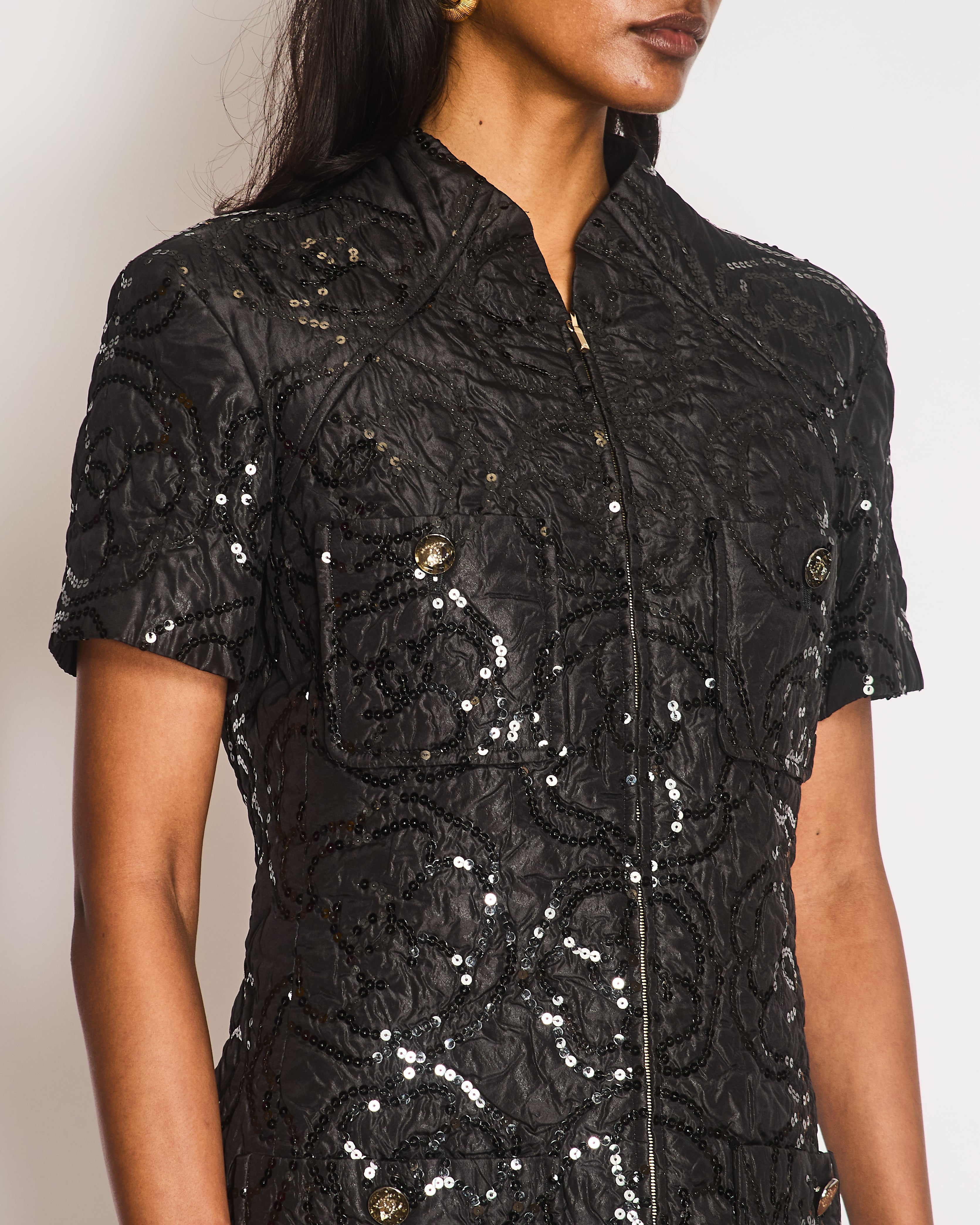 Chanel Black Padded Short-Sleeved Mini Dress with Sequin Camellia Embroideries and Front Pockets with Crystal CC Logo Buttons Size FR 38 (UK 10