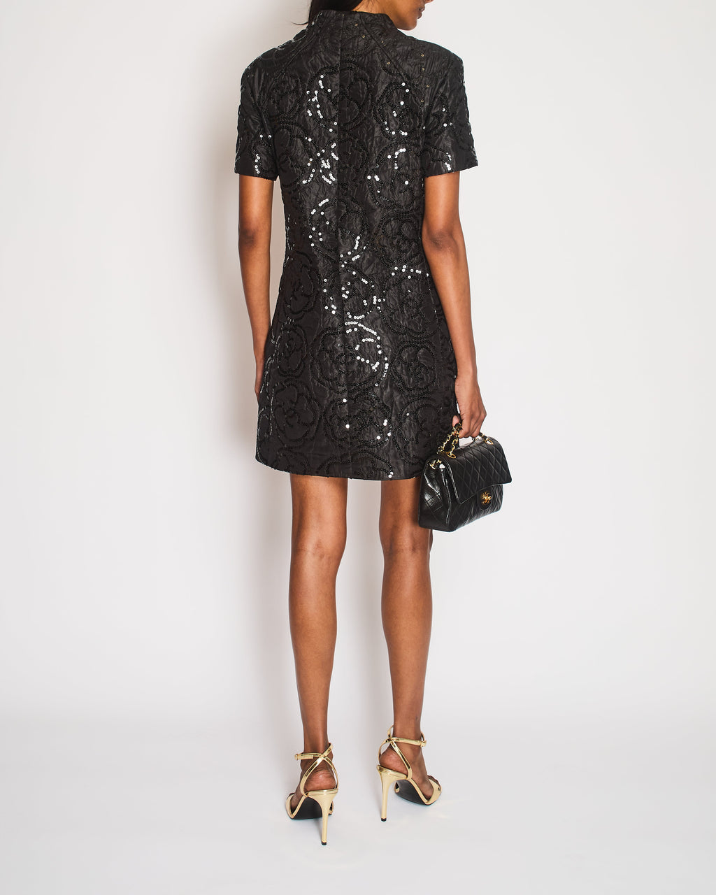 Chanel Black Padded Short-Sleeved Mini Dress with Sequin Camellia Embroideries and Front Pockets with Crystal CC Logo Buttons Size FR 38 (UK 10