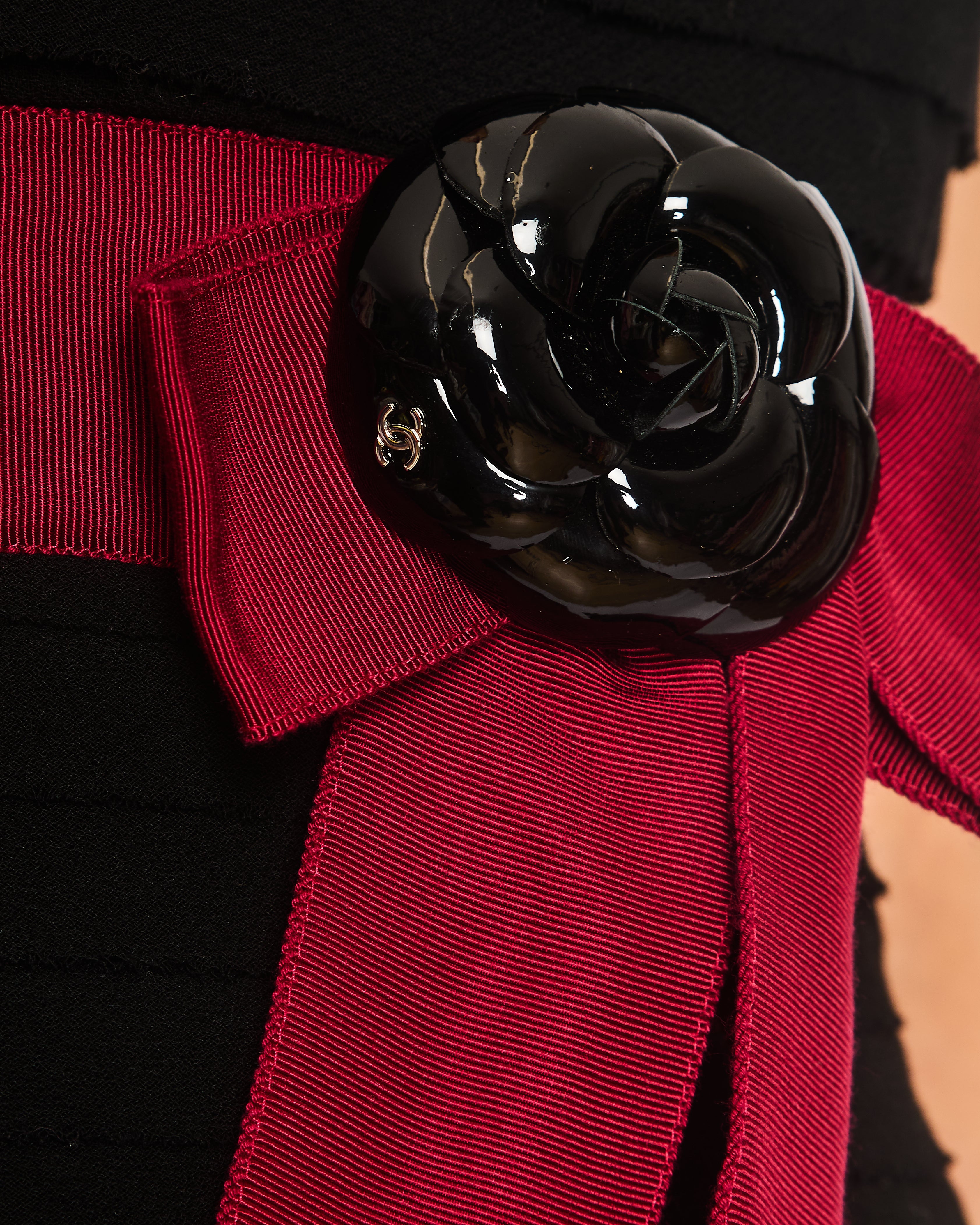 Chanel Black Wool Pleated Mini Dress with Red Sash Belt and Detachable Patent Leather Camellia Brooch with Gold CC Logo Detail Size FR 34 (UK 6)