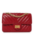 Chanel Aged Calfskin Chevron Quilted 2.55 Reissue Mini Flap Dark Red