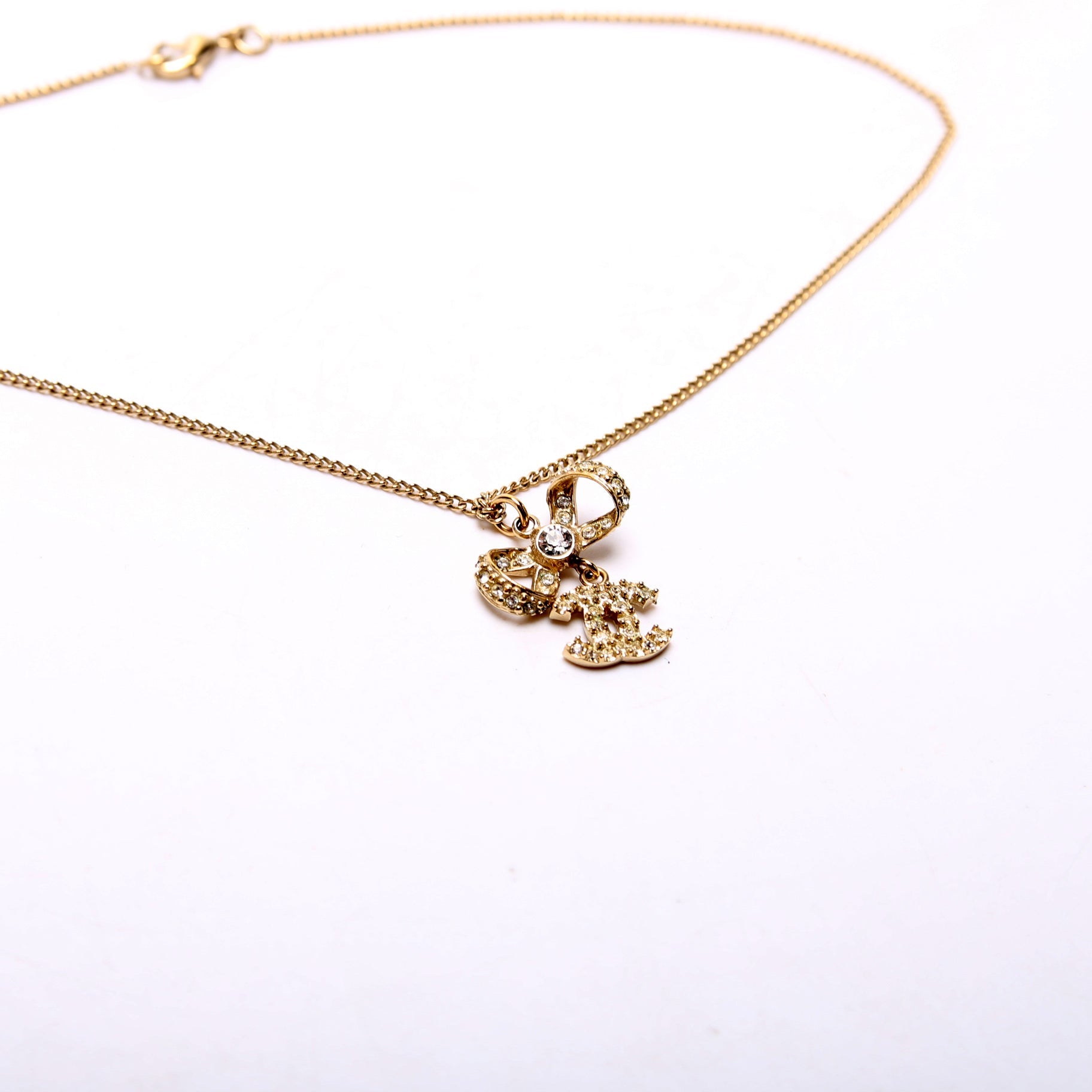 CC Bow Rhinestone Pendant