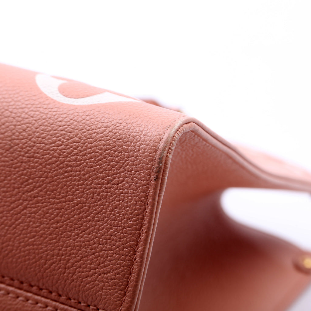 ONTHEGO MM Bicolor Empreinte Giant Monogram Pink