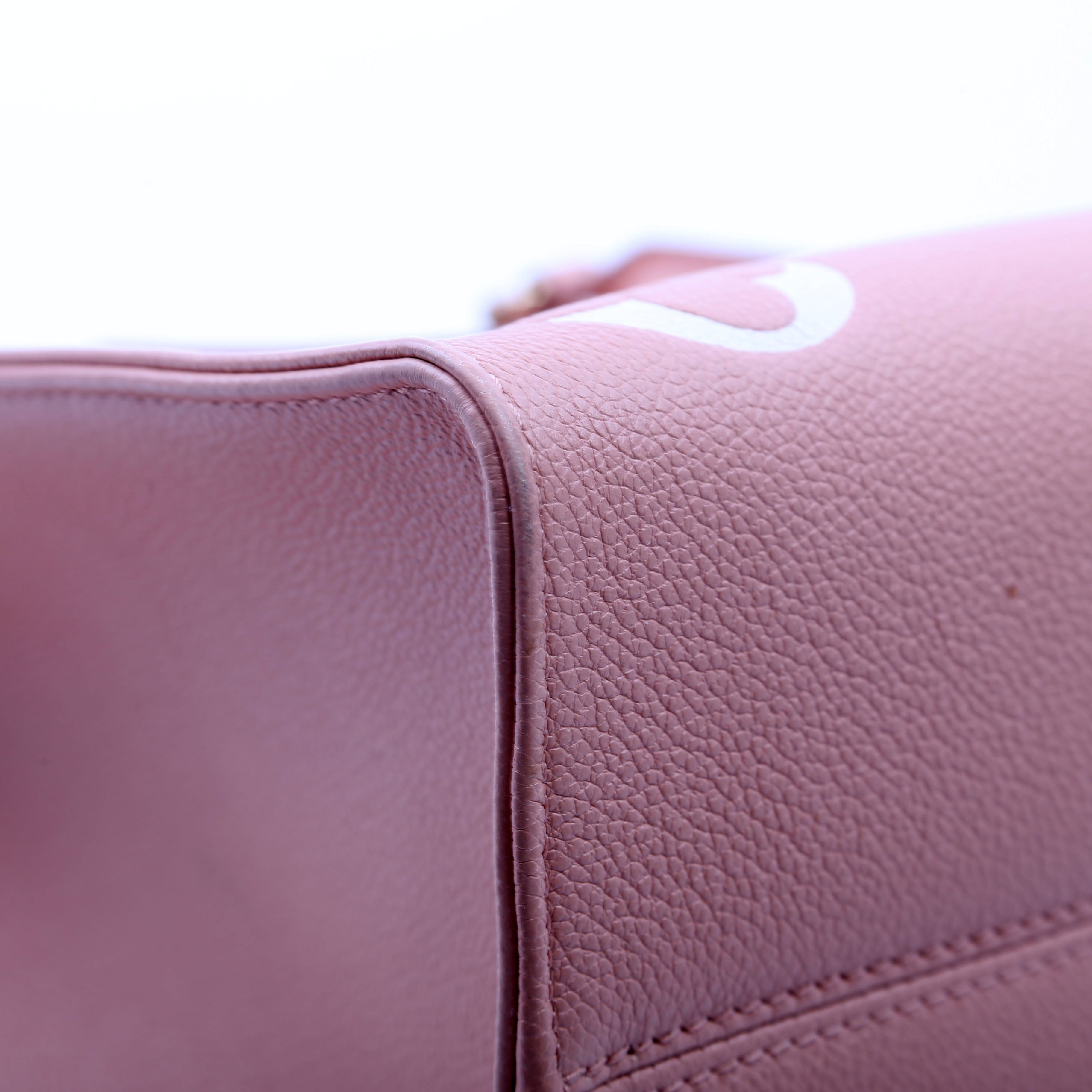 ONTHEGO MM Bicolor Empreinte Giant Monogram Pink