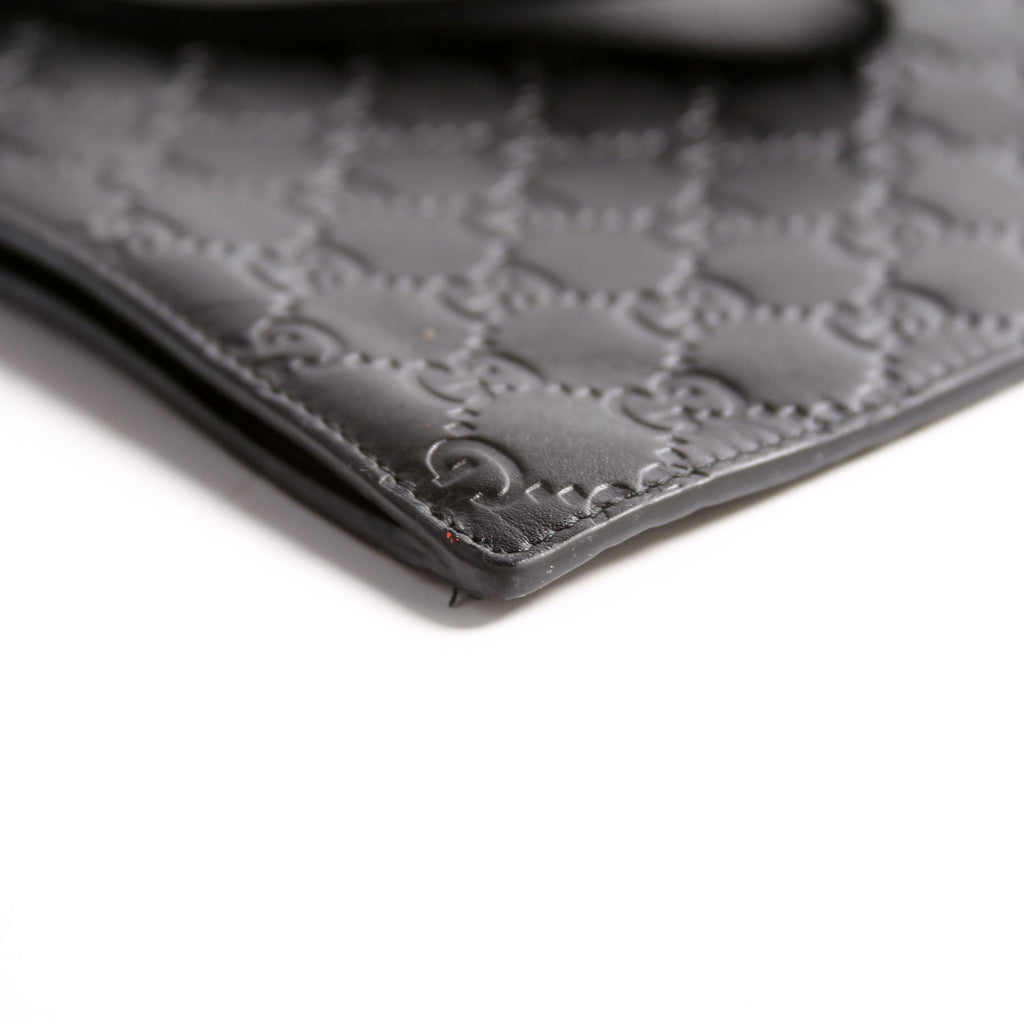 473963 Guccissima Zip Clutch Black