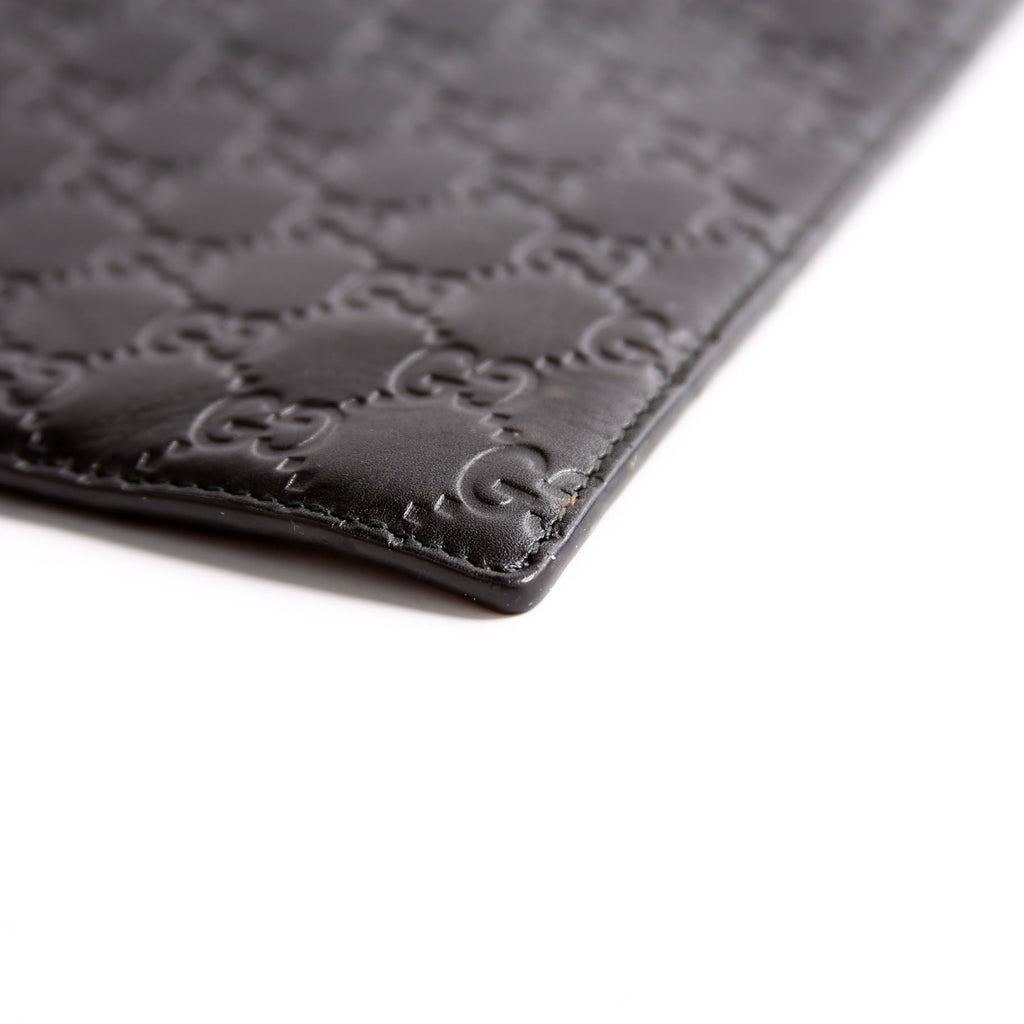 473963 Guccissima Zip Clutch Black