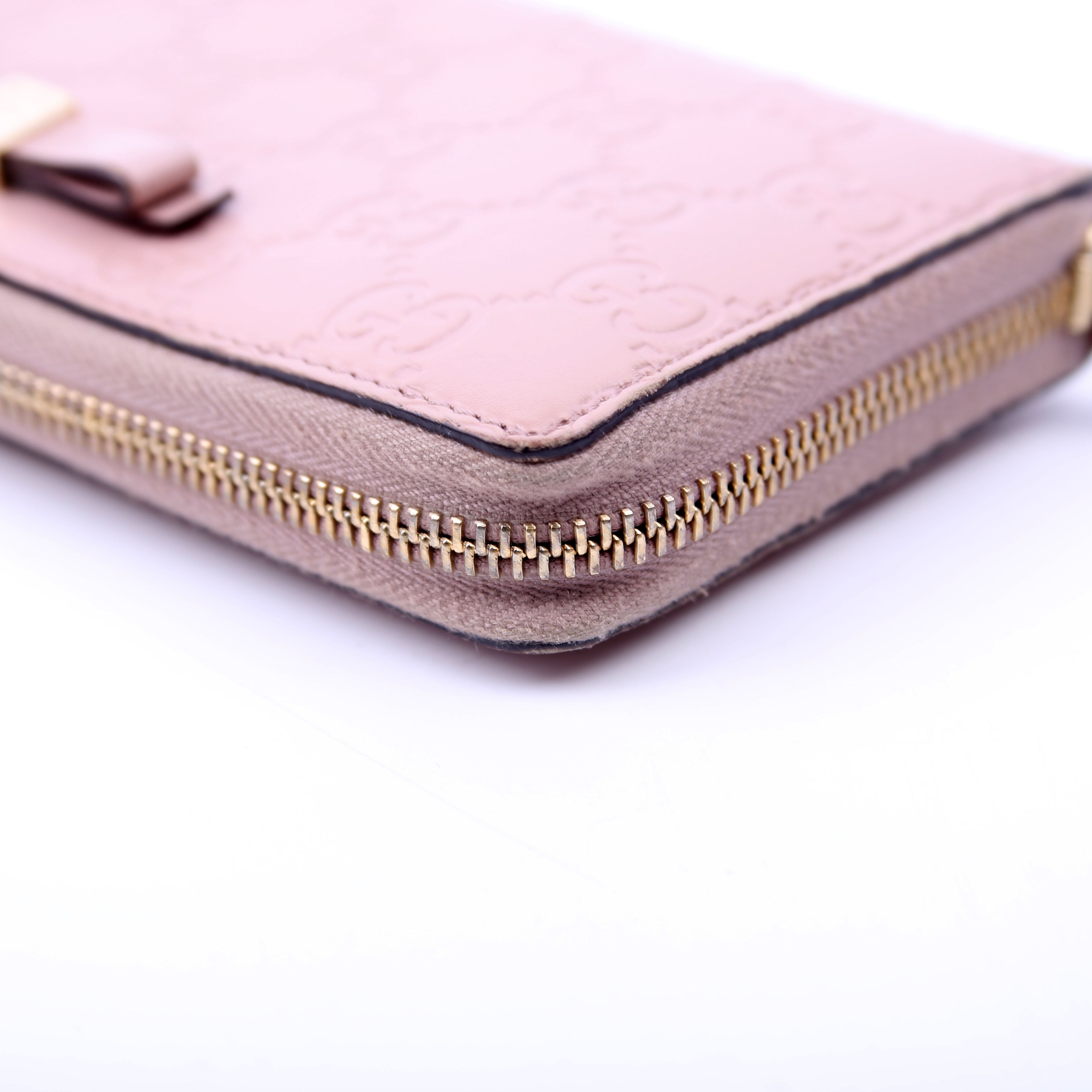 388680 Bow Zip Around Wallet Guccissima Nude