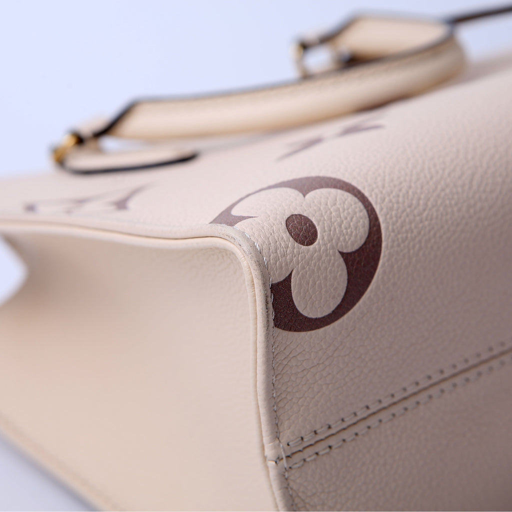 ONTHEGO PM Bicolor Empreinte Cream/Taupe