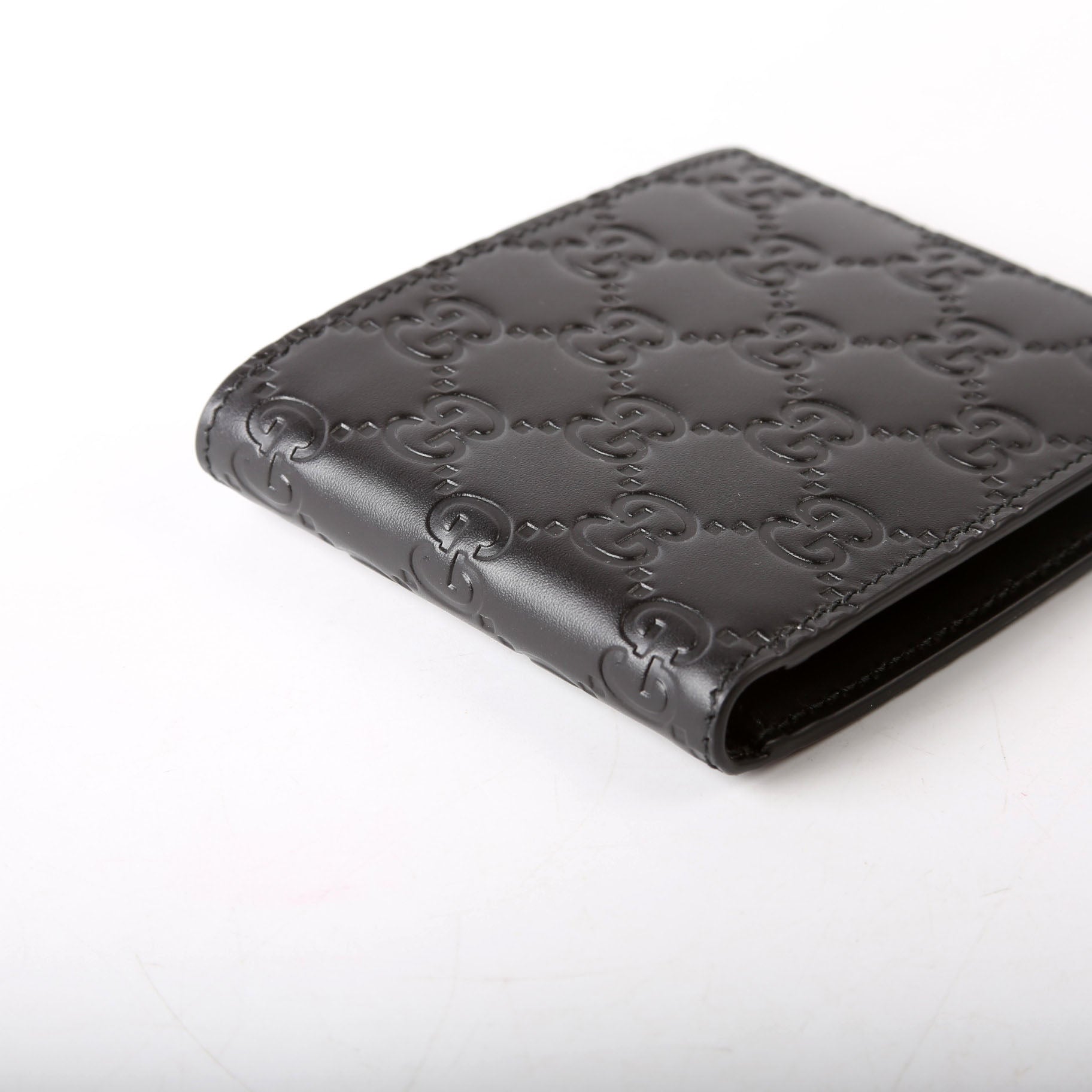 779836 GG Emblem Bi-Fold Wallet Black