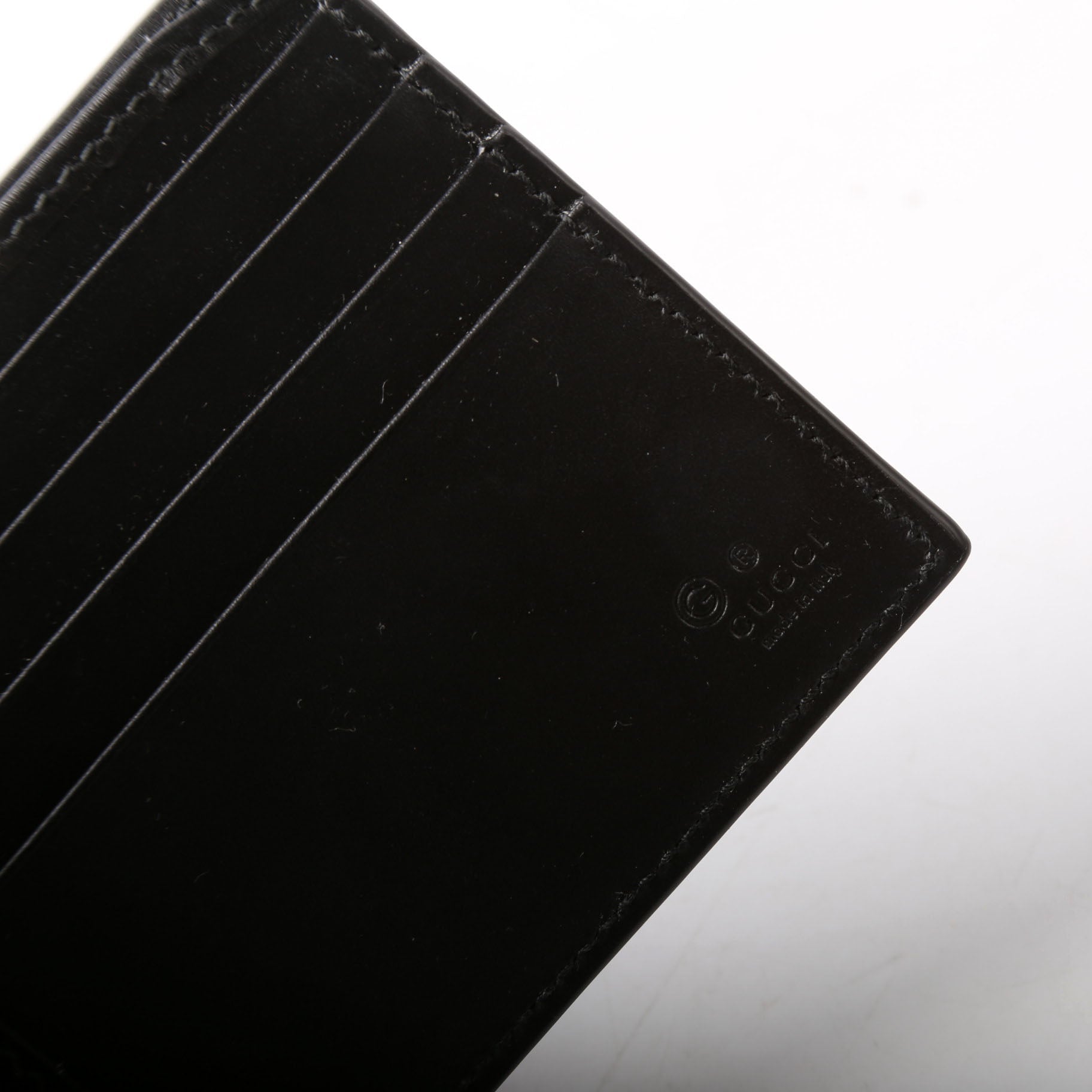 779836 GG Emblem Bi-Fold Wallet Black