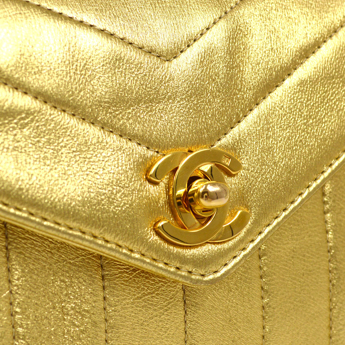 CHANEL 1991-1994 Chevron Letter Flap Vertical Bag Mini Gold Lambskin