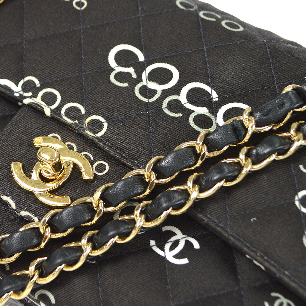 CHANEL 2001-2003 COCO patterned Classic Double Flap Medium Black Canvas