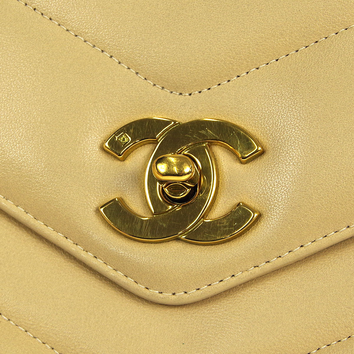Chanel * 1994-1996 Beige Lambskin Mini Chevron Letter Flap Bag