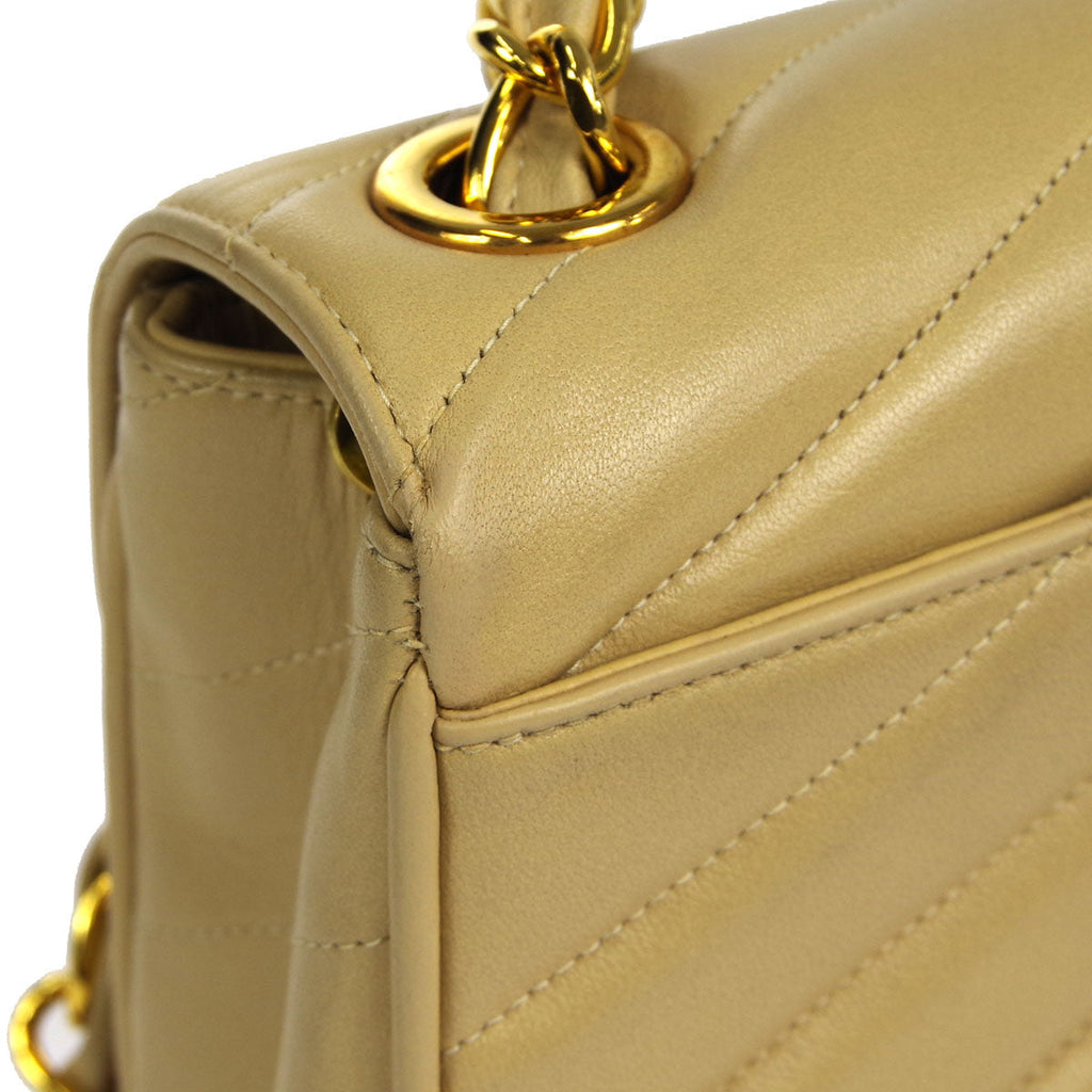 Chanel * 1994-1996 Beige Lambskin Mini Chevron Letter Flap Bag