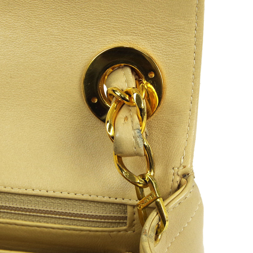 Chanel * 1994-1996 Beige Lambskin Mini Chevron Letter Flap Bag
