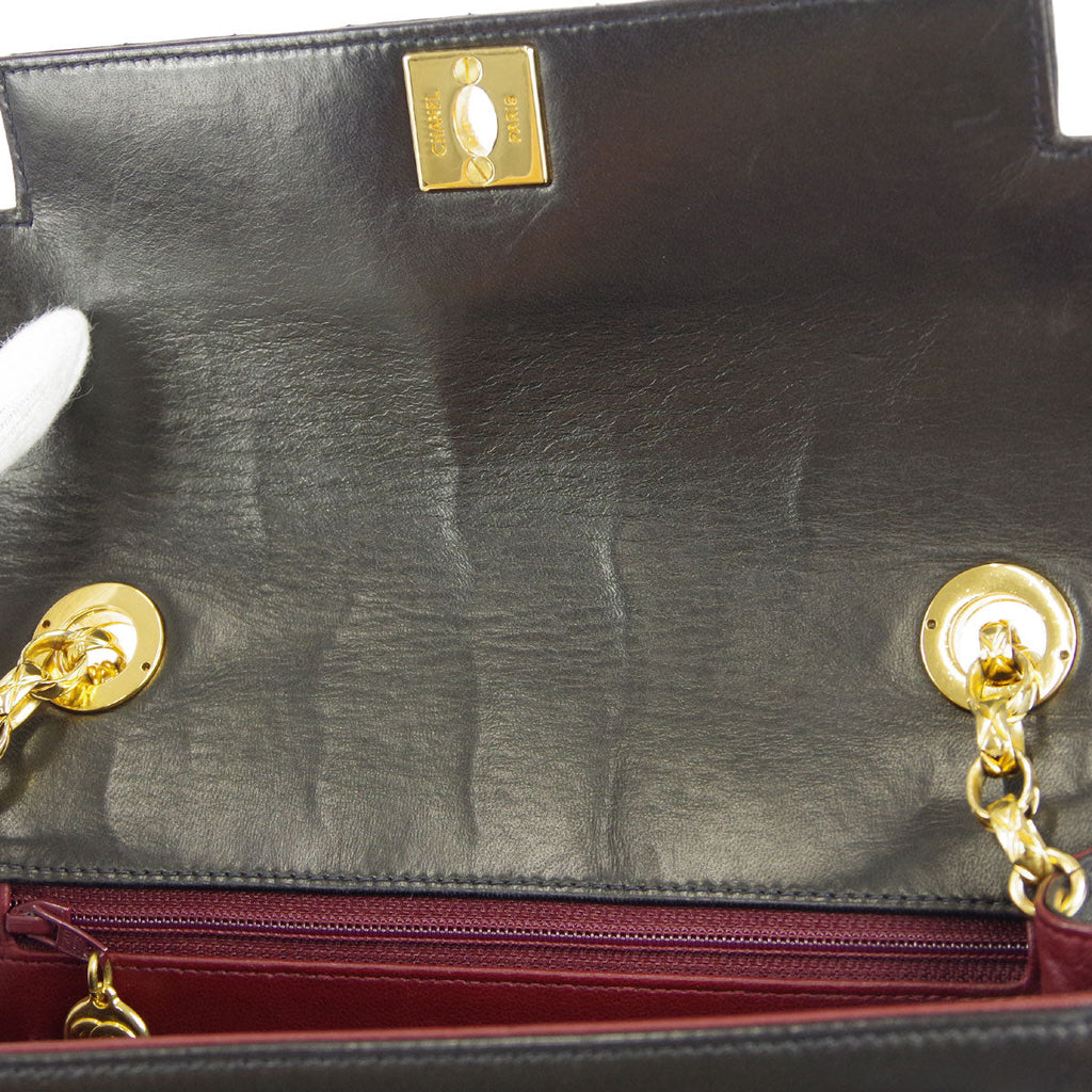 Chanel * 1991-1994 Black Lambskin Mini Vertical Stitch Flap Bag