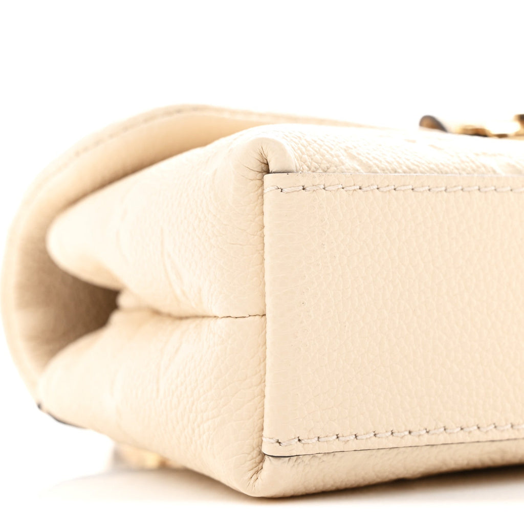 Louis Vuitton Empreinte Monogram Nano Madeleine Creme