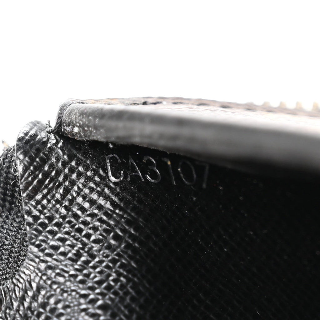 Louis Vuitton Monogram Macassar Vertical Zippy Wallet