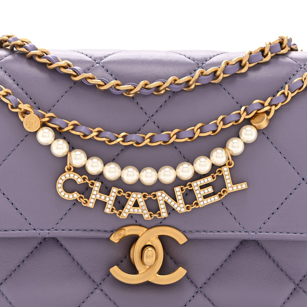 Chanel Shiny Lambskin Quilted Mini Pearl Logo Flap Light Purple