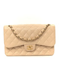 Chanel Caviar Quilted Jumbo Double Flap Beige
