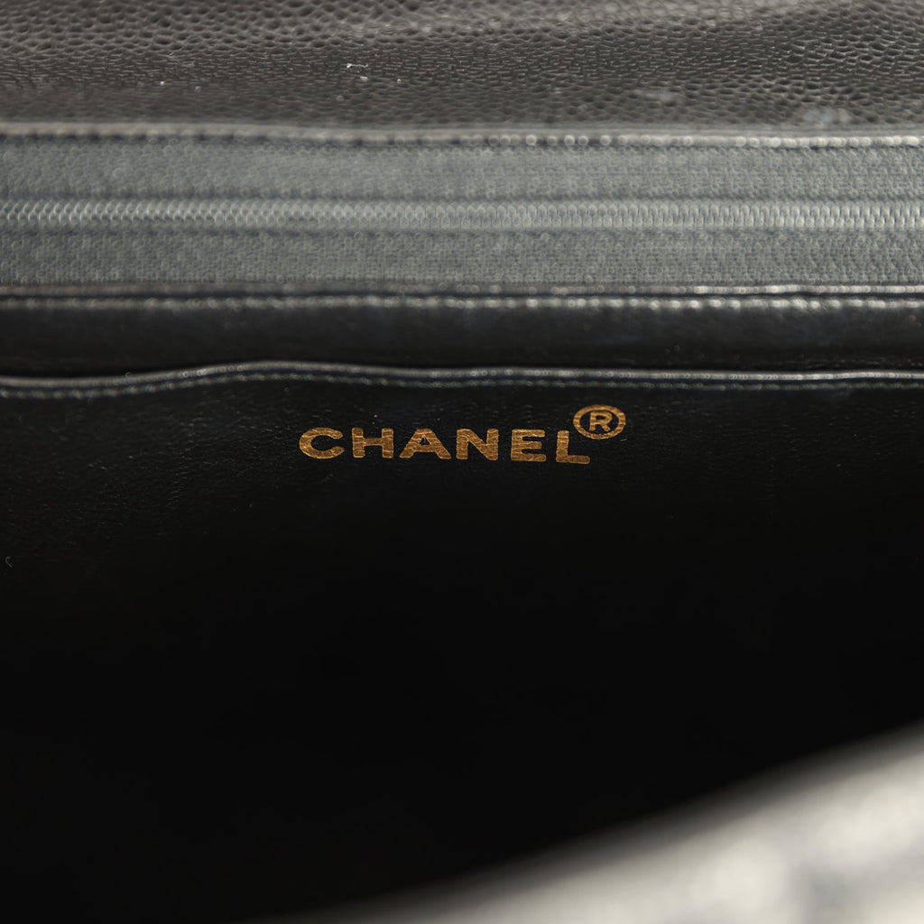 New Chanel Jumbo Classic Mademoiselle Vertical Flap Black Caviar Gold Hardware