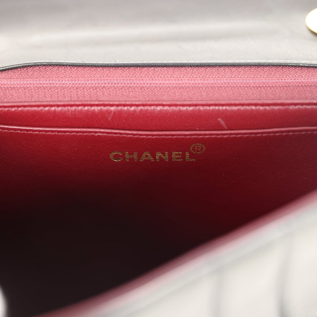 New Chanel Jumbo Classic Mademoiselle Vertical Flap Black Lambskin Gold Hardware