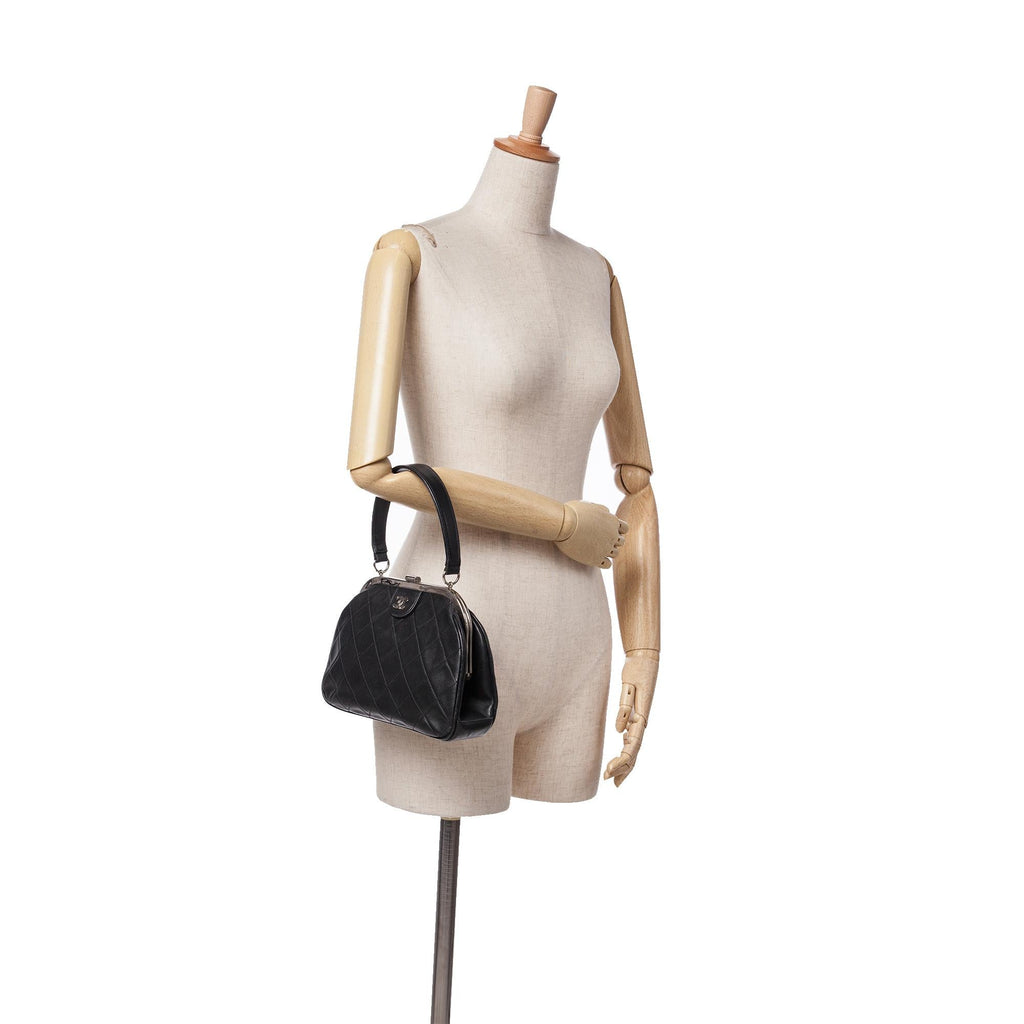 Chanel CC Quilted Lambskin Kiss Lock Frame Top Handle Bag