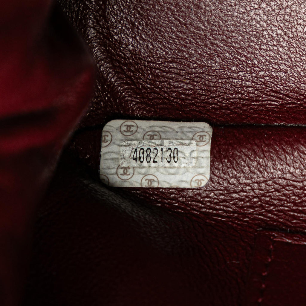 Chanel CC Quilted Lambskin Kiss Lock Frame Top Handle Bag
