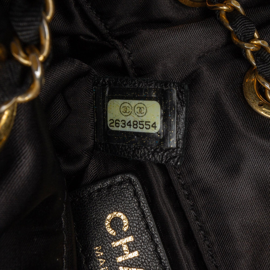 Chanel Quilted Nylon Crystal CC Drawstring Sling Bag