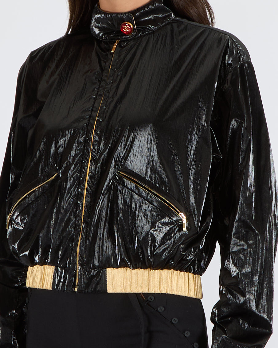 Chanel Cruise 2023 Black Shiny Bomber Jacket with Gold Trims and Zippers with Red and Gold CC Logo Button Size FR 38 (UK 10)