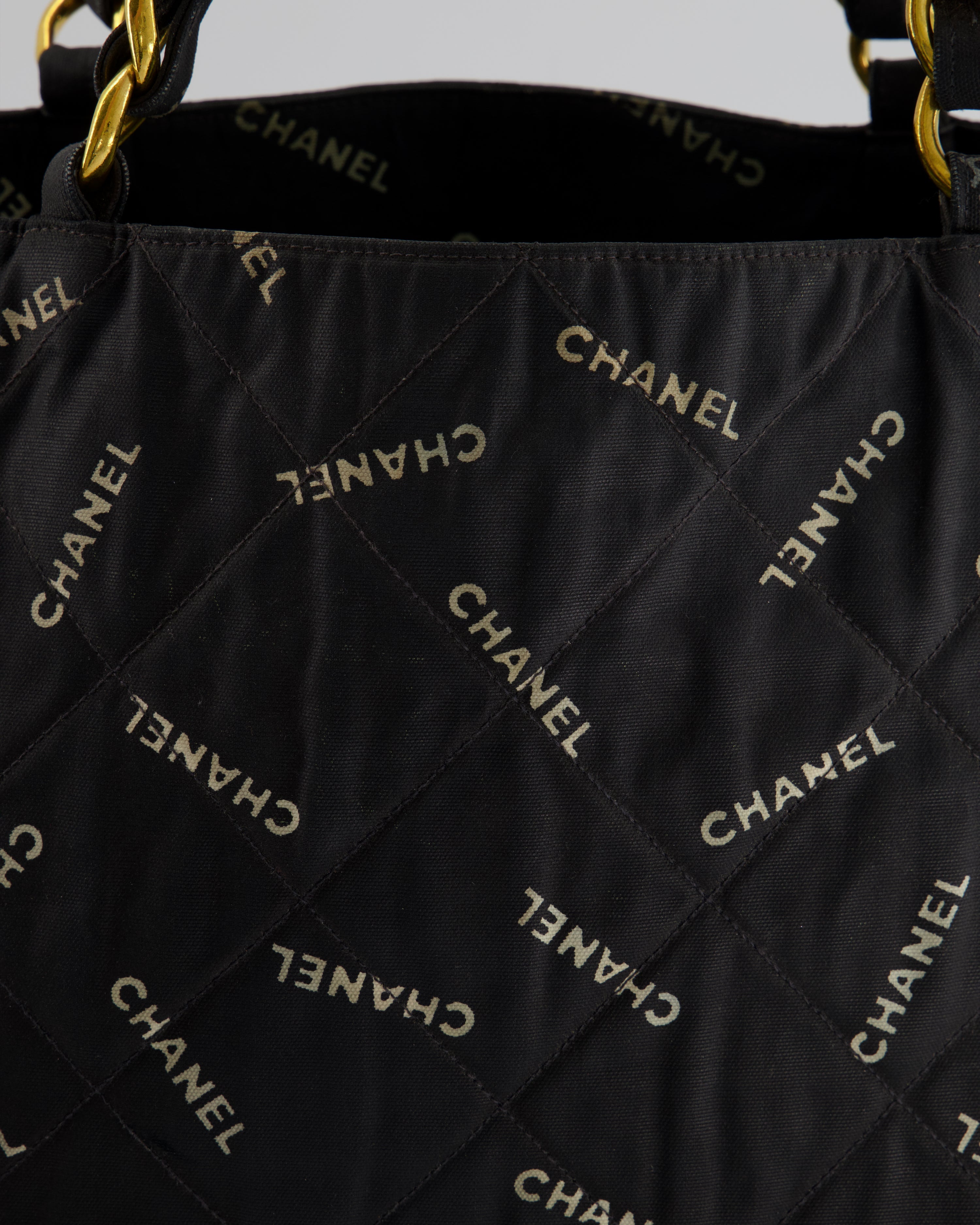 Chanel Vintage Black Bag in Quilted Canvas Logo Print with Gold Hardware