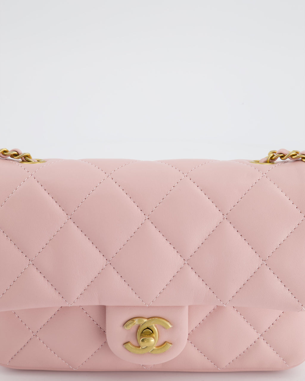 Chanel Pink 22B Mini Flap Bag in Lambskin Leather with Gold Hardware and Hearts Chain Detail