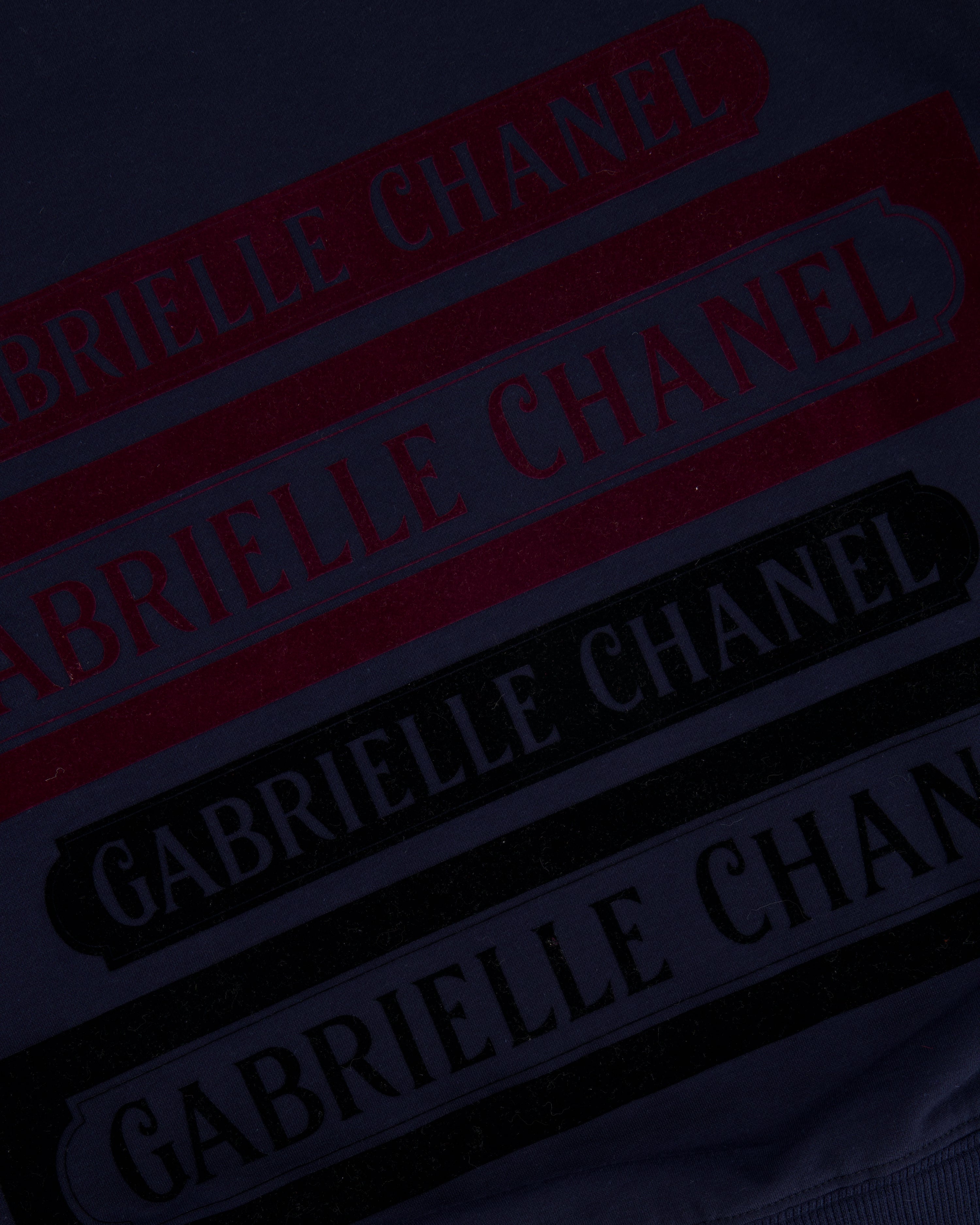 Chanel 17A Navy Crewneck Jumper with Black and Burgundy Velours Gabrielle Chanel Prints and Silver and Black CC Logo Button Detail Size FR 40 (UK 12)