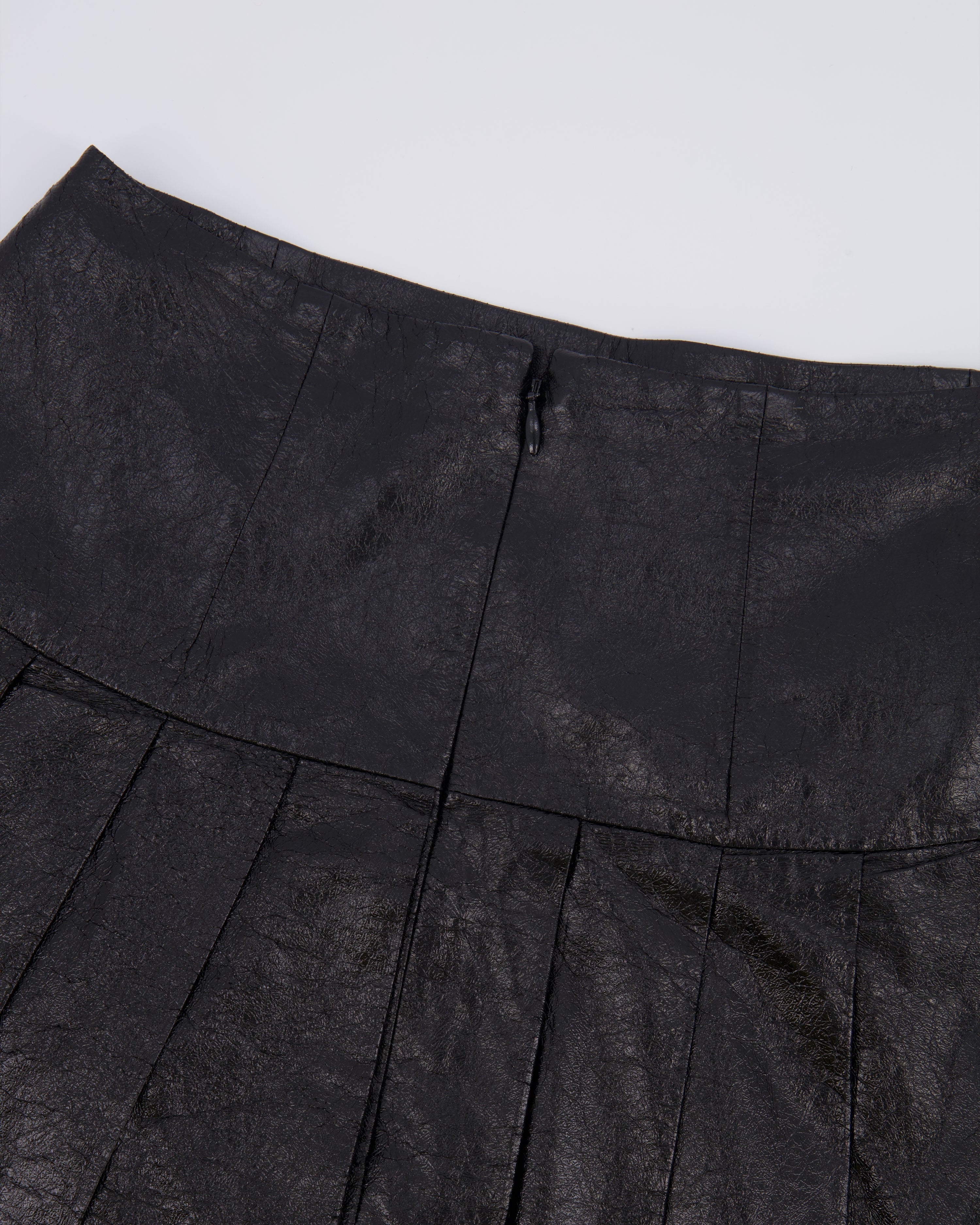 Chanel Fall 2013 Black Distressed Lambskin Leather Pleated Mini Skirt with Silver and Black Globe CC Logo Button Detail Size FR 34 (UK 6)