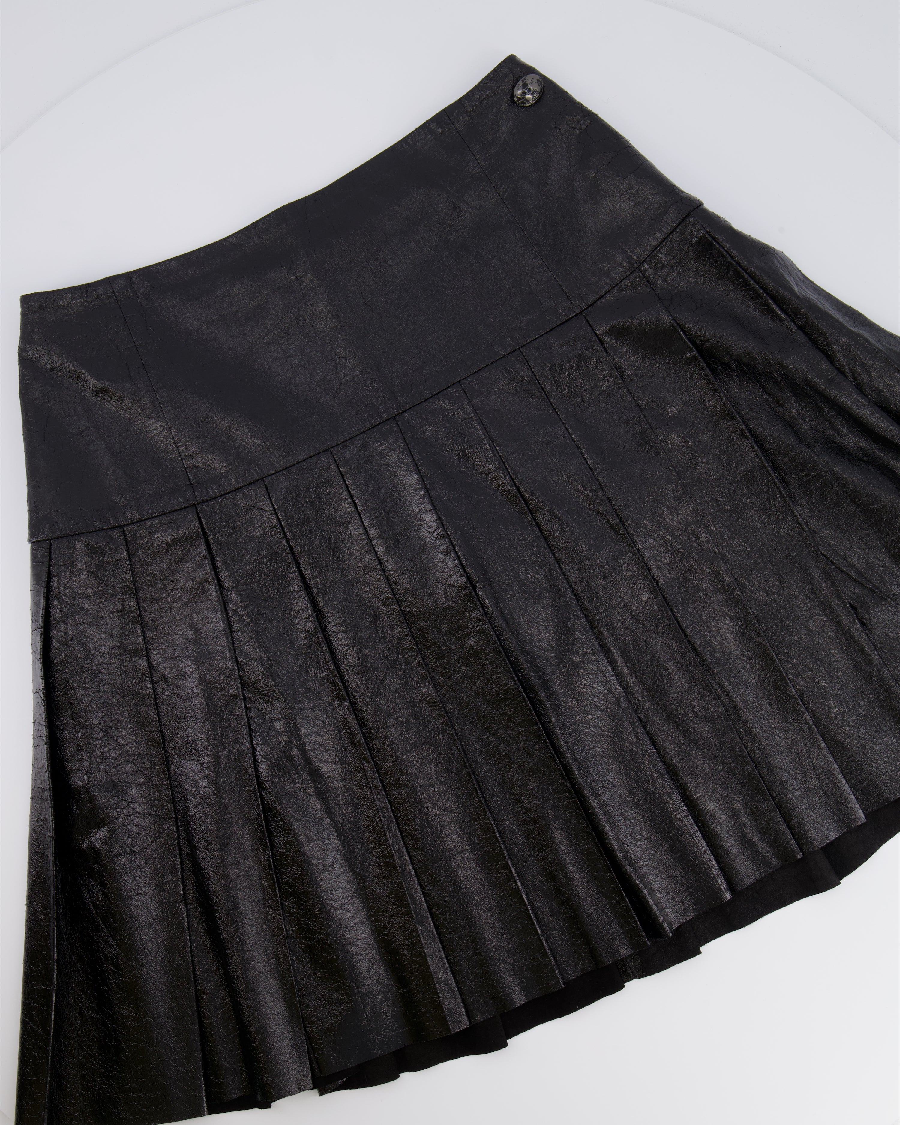 Chanel Fall 2013 Black Distressed Lambskin Leather Pleated Mini Skirt with Silver and Black Globe CC Logo Button Detail Size FR 34 (UK 6)