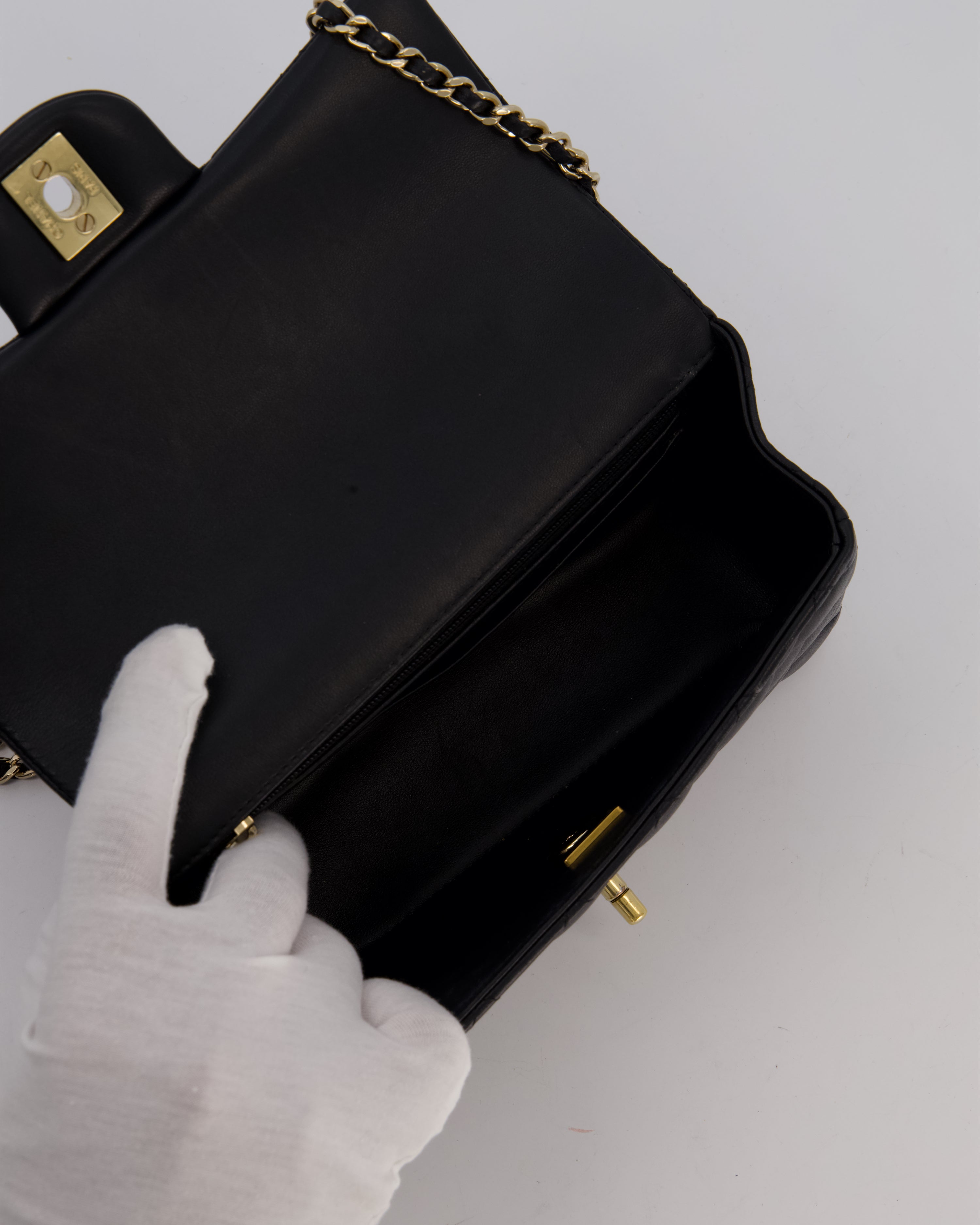 Chanel Black Mini Rectangular Top Handle Flap Bag in Lambskin Leather with Champagne Hardware and Strass Removable Bow Charm