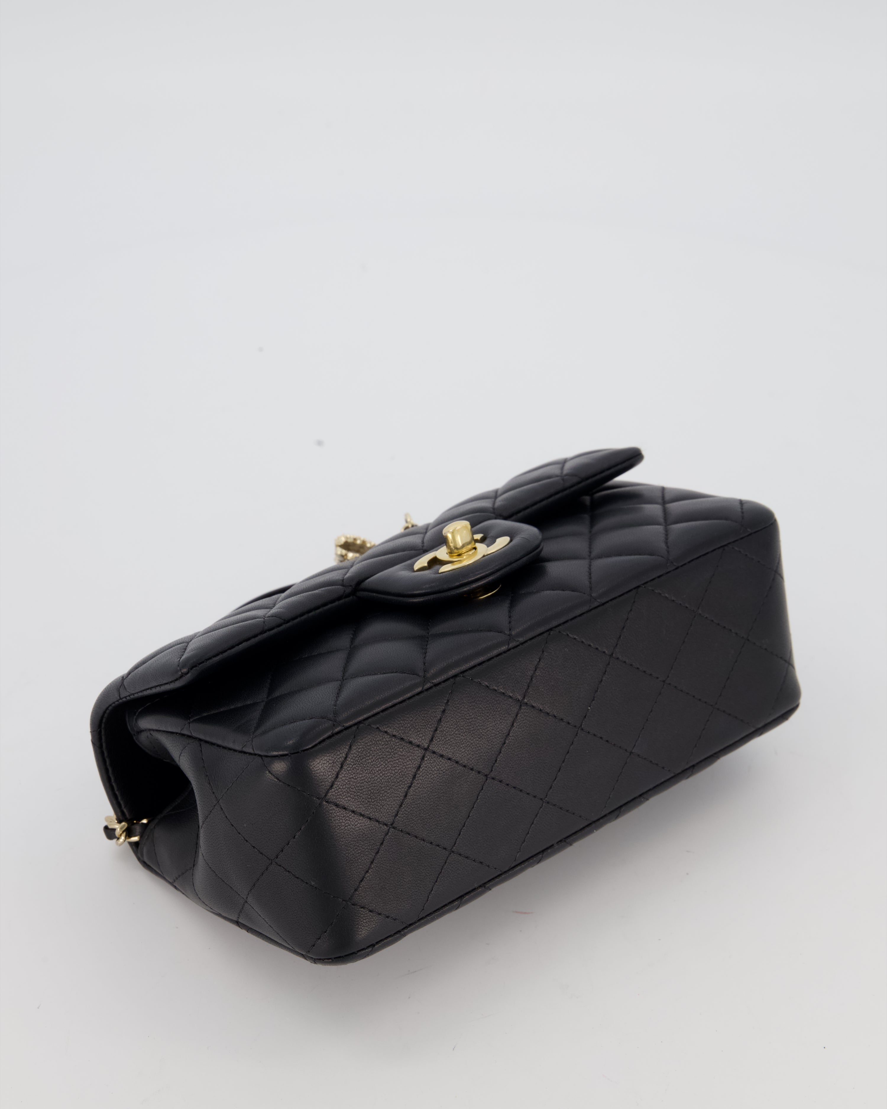 Chanel Black Mini Rectangular Top Handle Flap Bag in Lambskin Leather with Champagne Hardware and Strass Removable Bow Charm