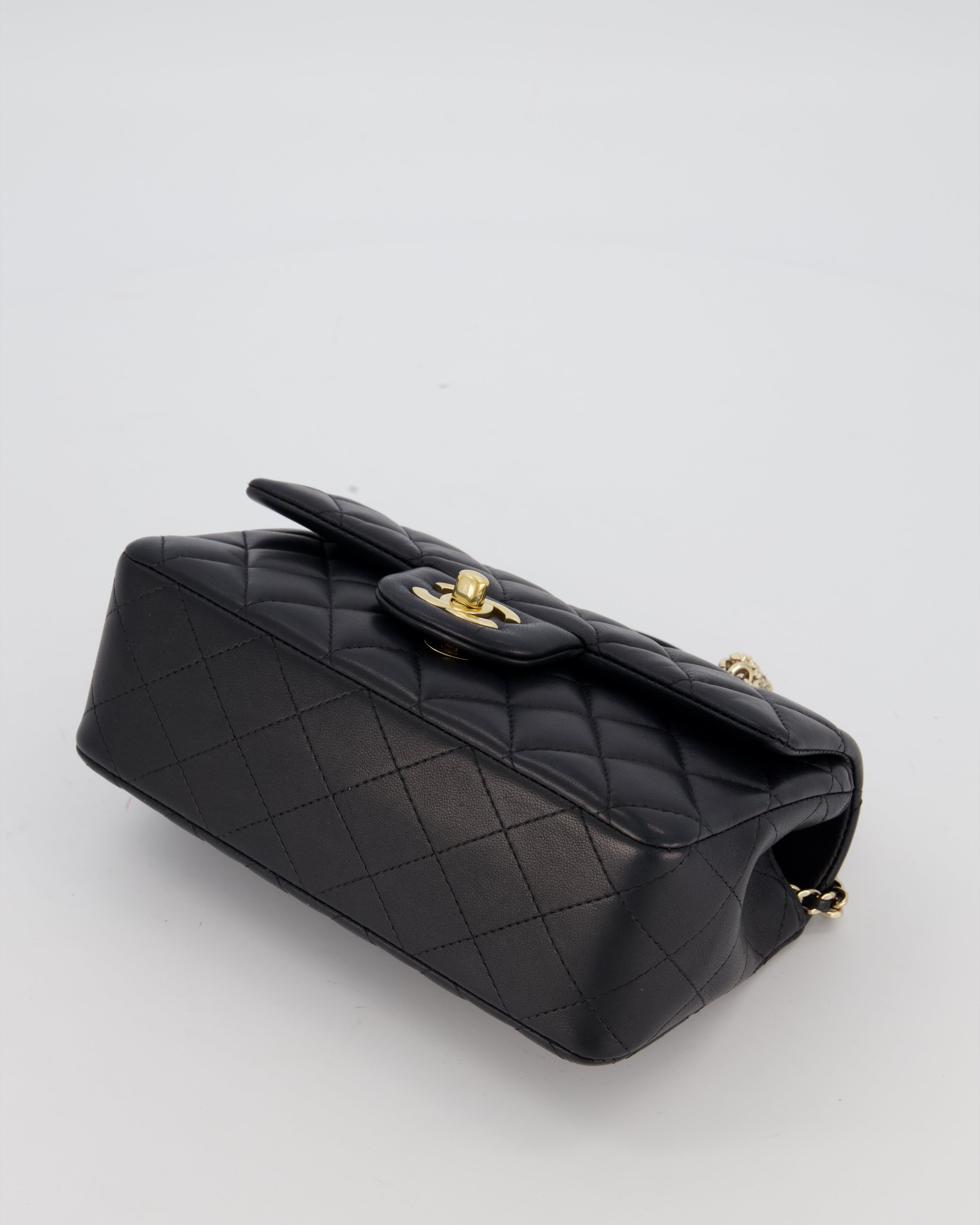 Chanel Black Mini Rectangular Top Handle Flap Bag in Lambskin Leather with Champagne Hardware and Strass Removable Bow Charm
