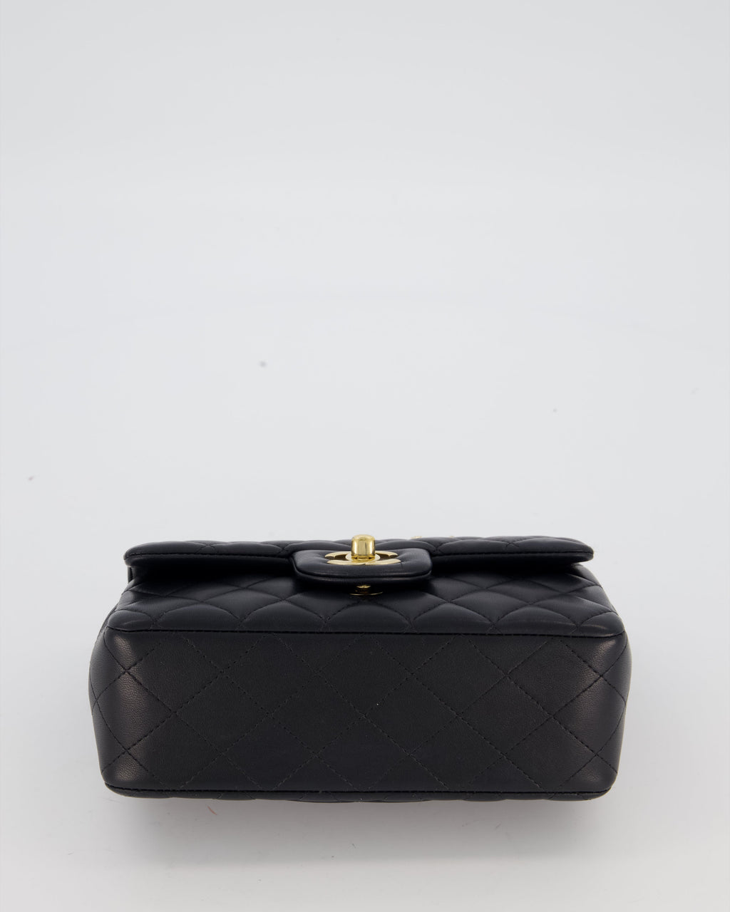 Chanel Black Mini Rectangular Top Handle Flap Bag in Lambskin Leather with Champagne Hardware and Strass Removable Bow Charm