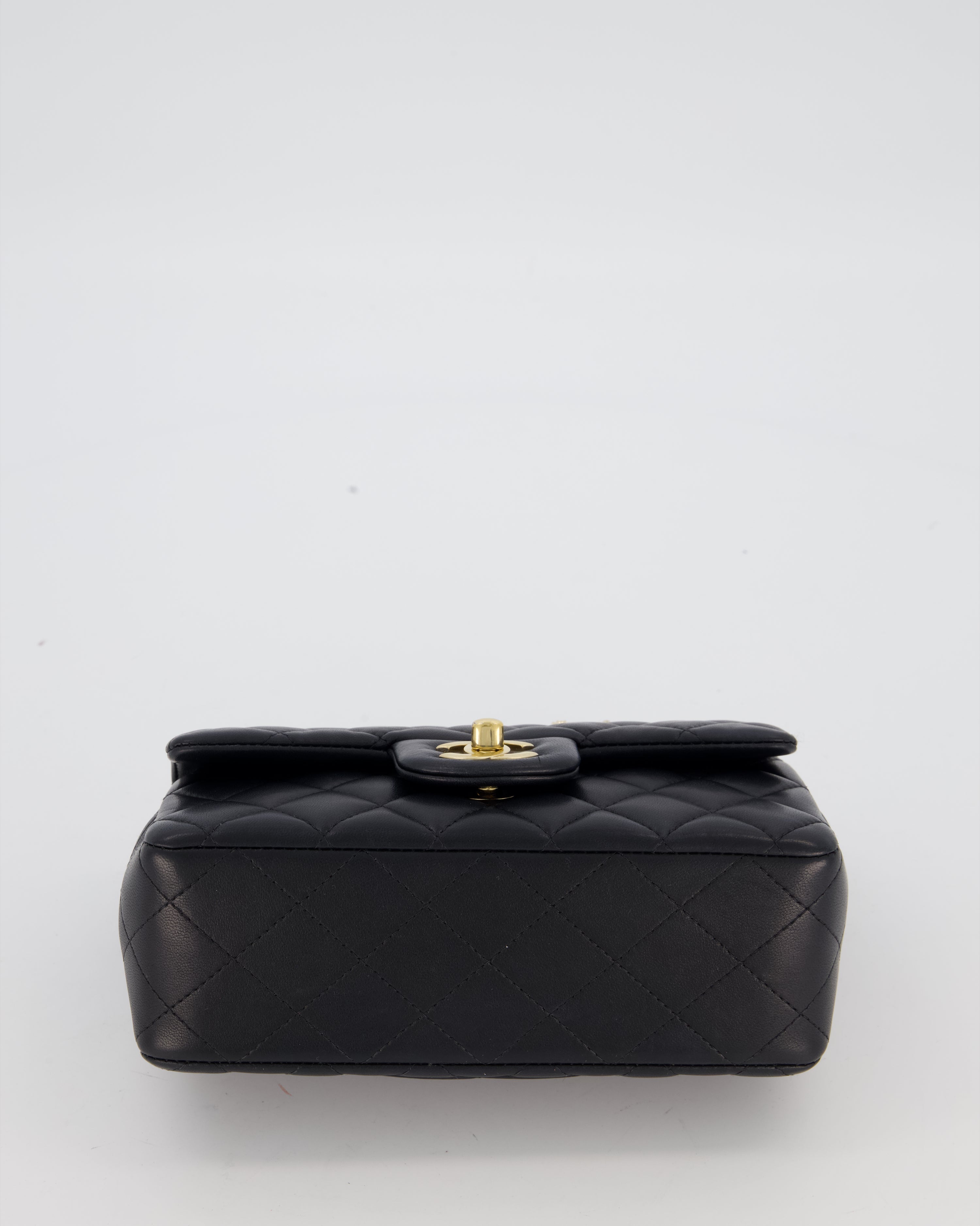 Chanel Black Mini Rectangular Top Handle Flap Bag in Lambskin Leather with Champagne Hardware and Strass Removable Bow Charm