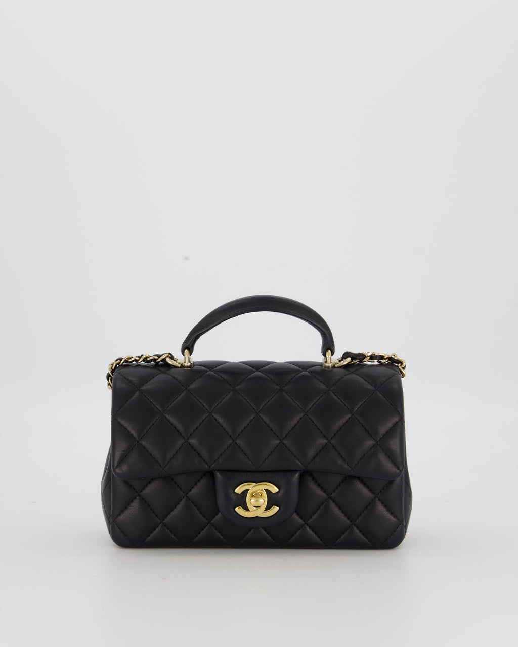 Chanel Black Mini Rectangular Top Handle Flap Bag in Lambskin Leather with Champagne Hardware and Strass Removable Bow Charm