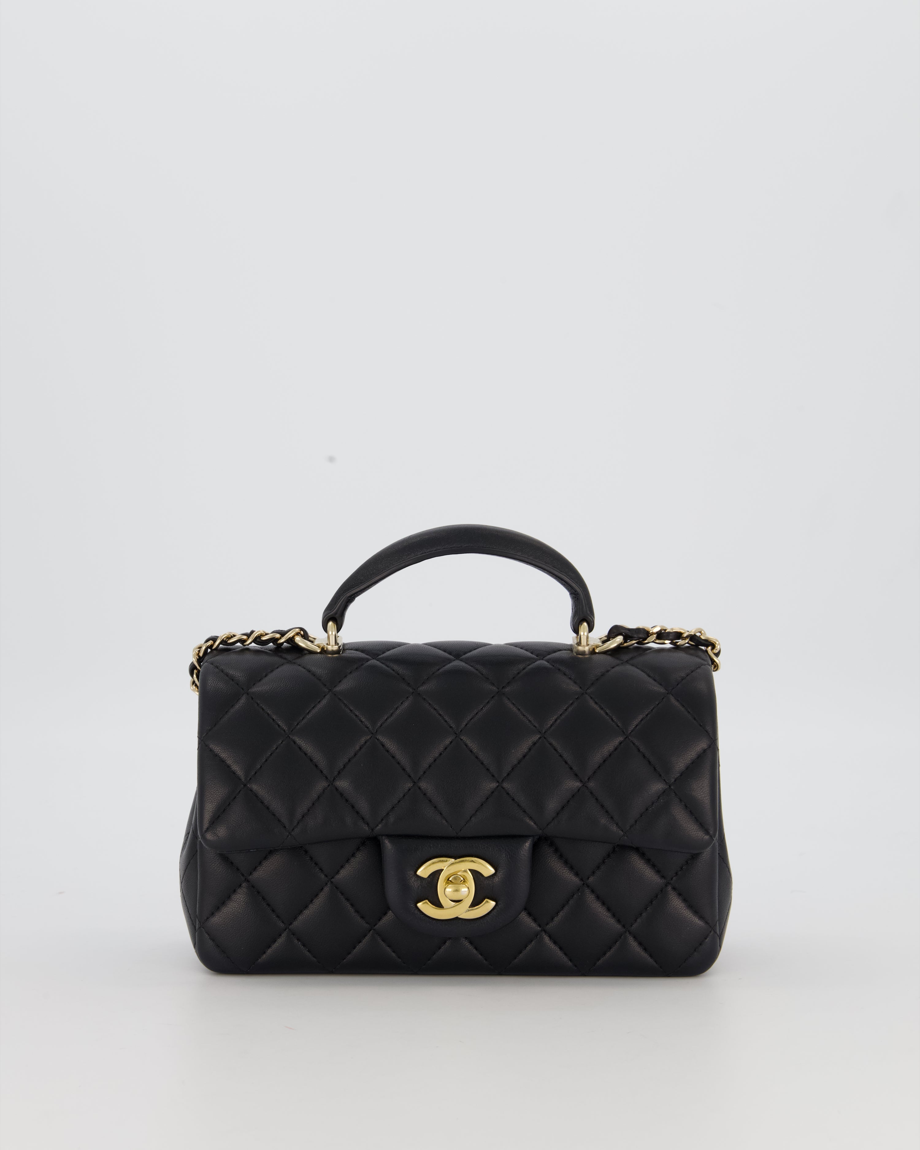 Chanel Black Mini Rectangular Top Handle Flap Bag in Lambskin Leather with Champagne Hardware and Strass Removable Bow Charm
