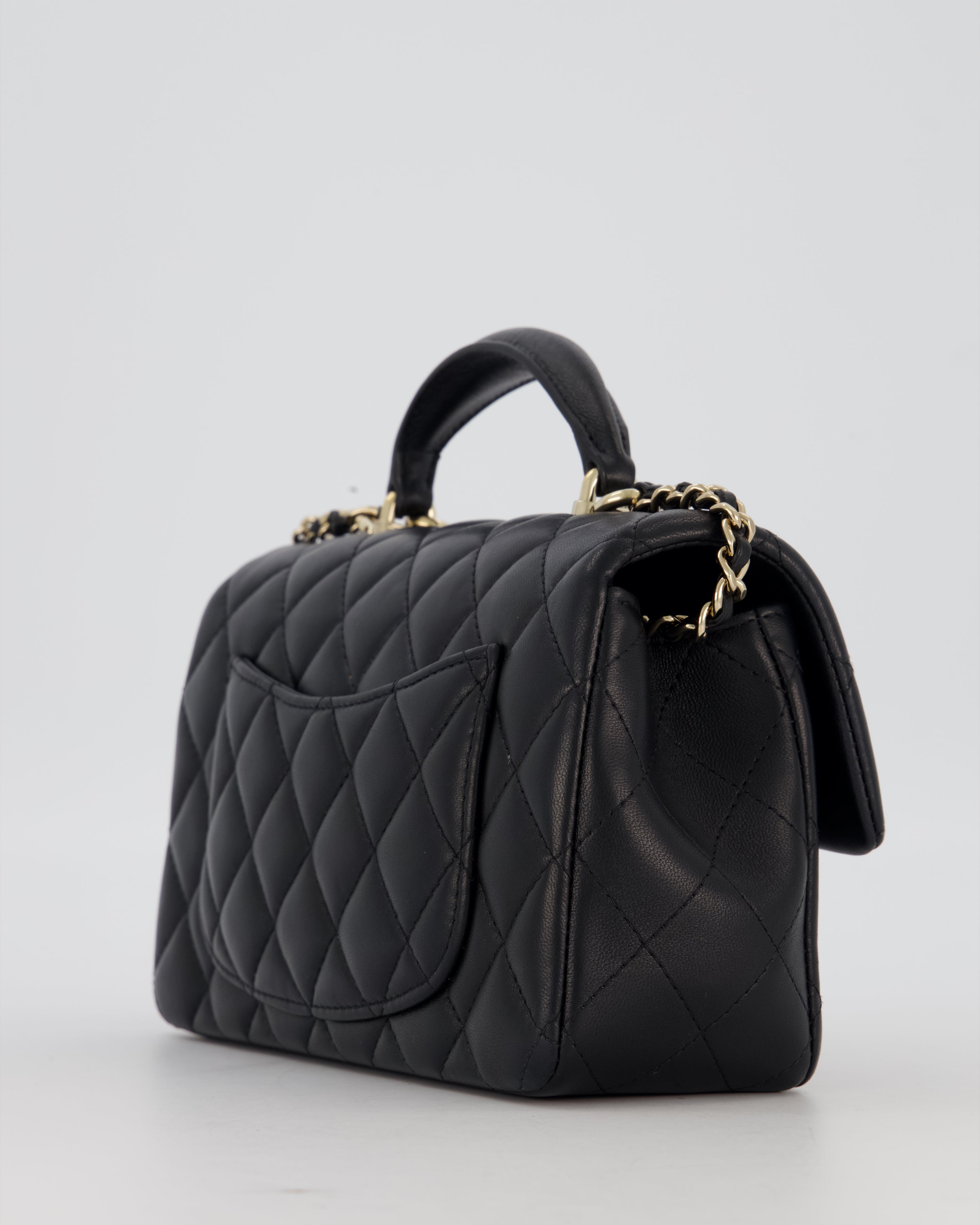 Chanel Black Mini Rectangular Top Handle Flap Bag in Lambskin Leather with Champagne Hardware and Strass Removable Bow Charm