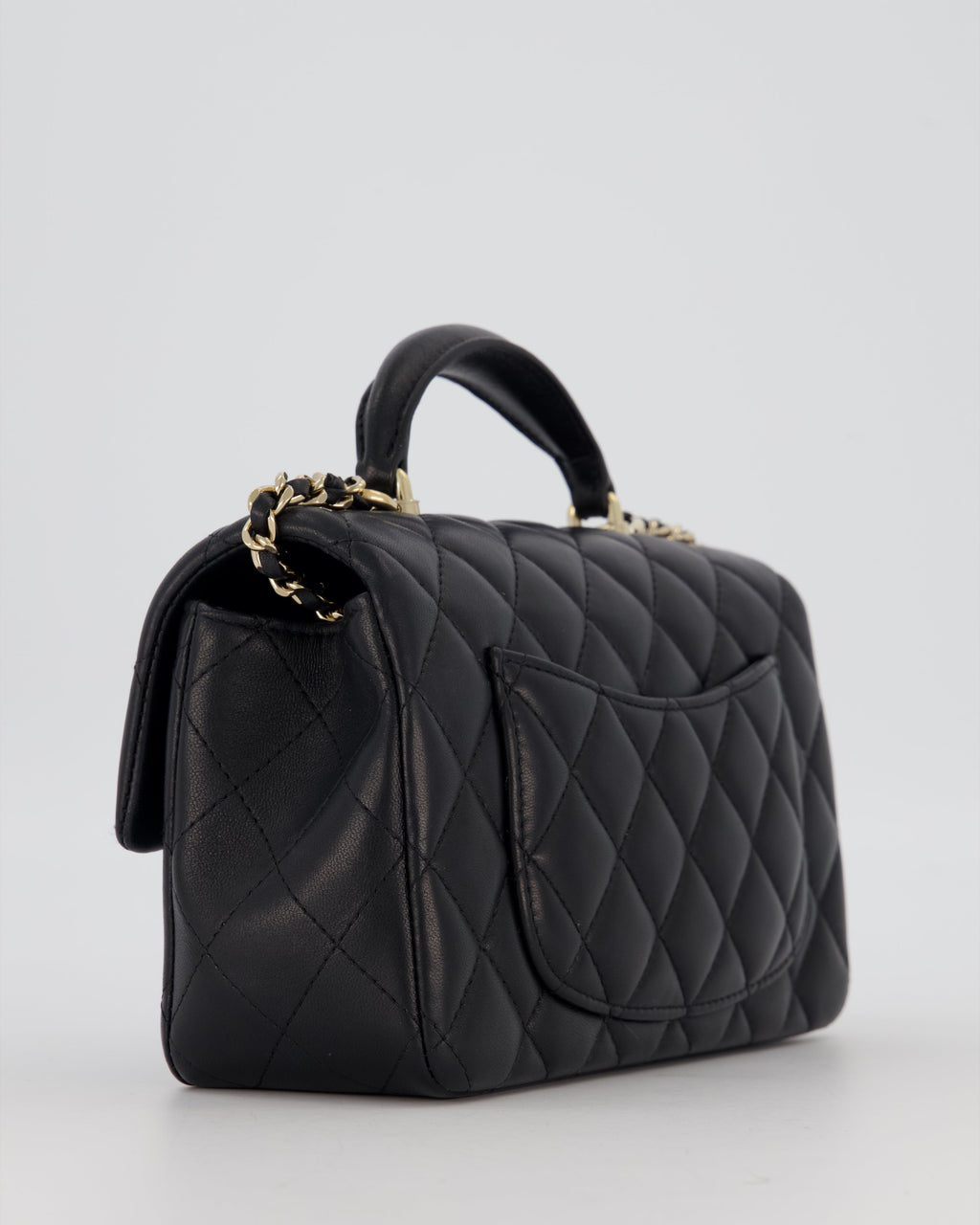 Chanel Black Mini Rectangular Top Handle Flap Bag in Lambskin Leather with Champagne Hardware and Strass Removable Bow Charm