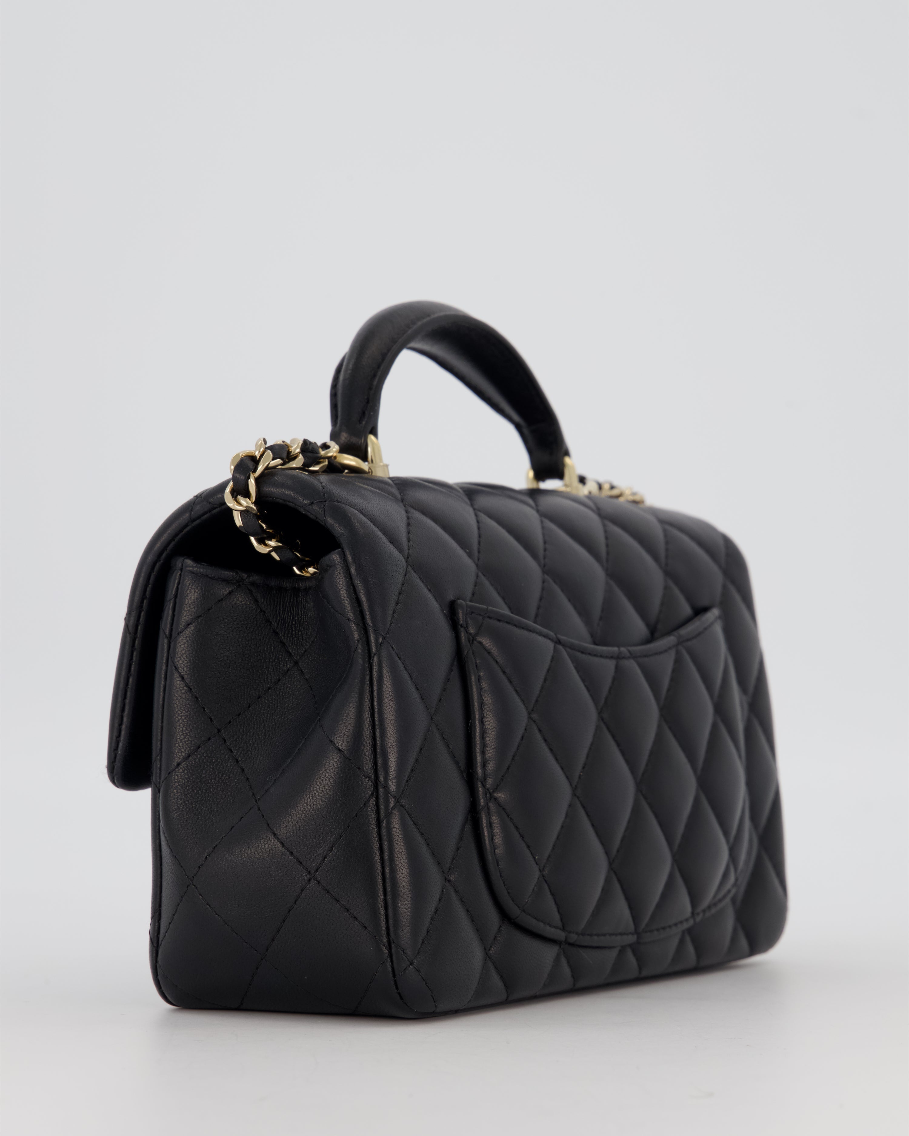 Chanel Black Mini Rectangular Top Handle Flap Bag in Lambskin Leather with Champagne Hardware and Strass Removable Bow Charm