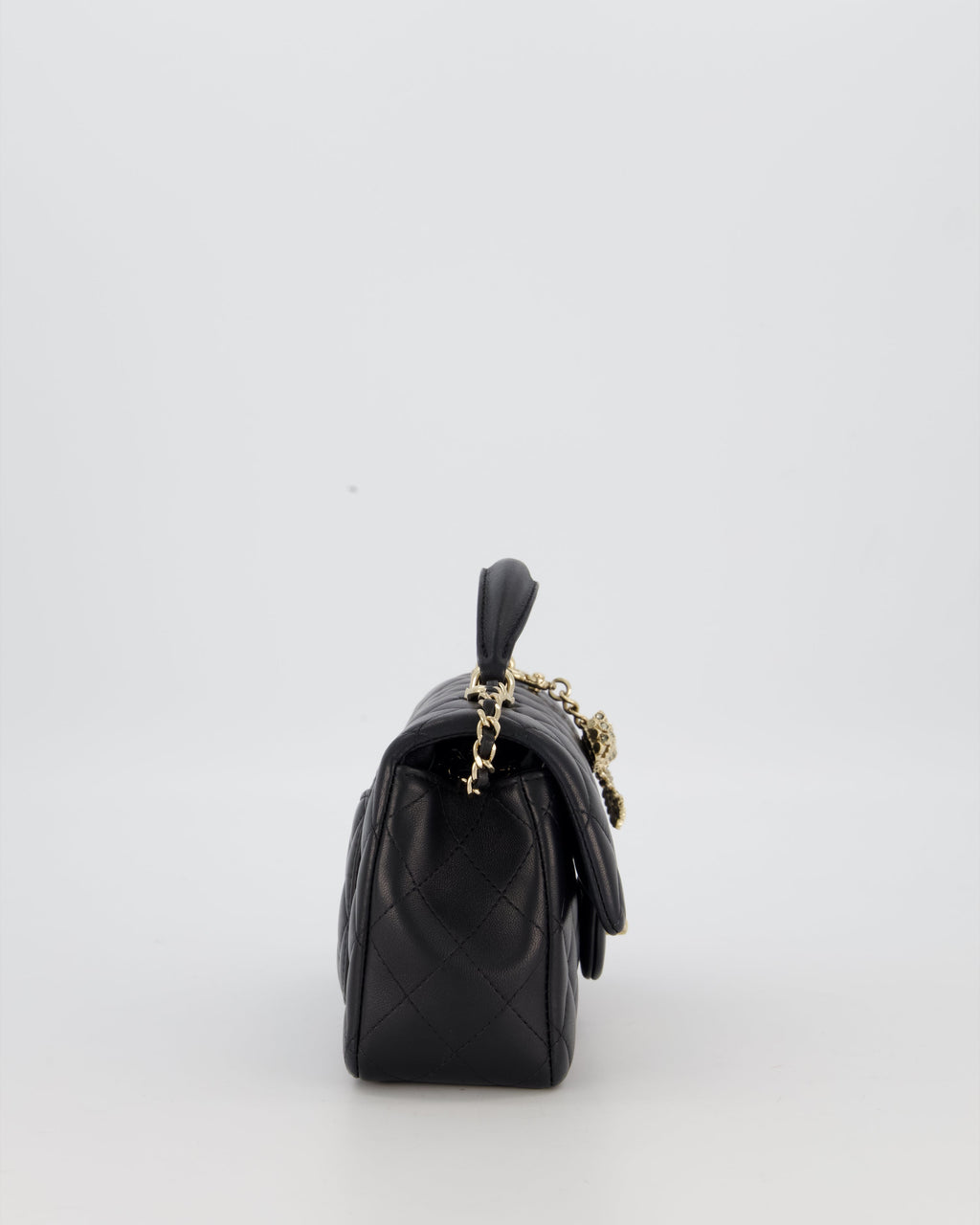 Chanel Black Mini Rectangular Top Handle Flap Bag in Lambskin Leather with Champagne Hardware and Strass Removable Bow Charm