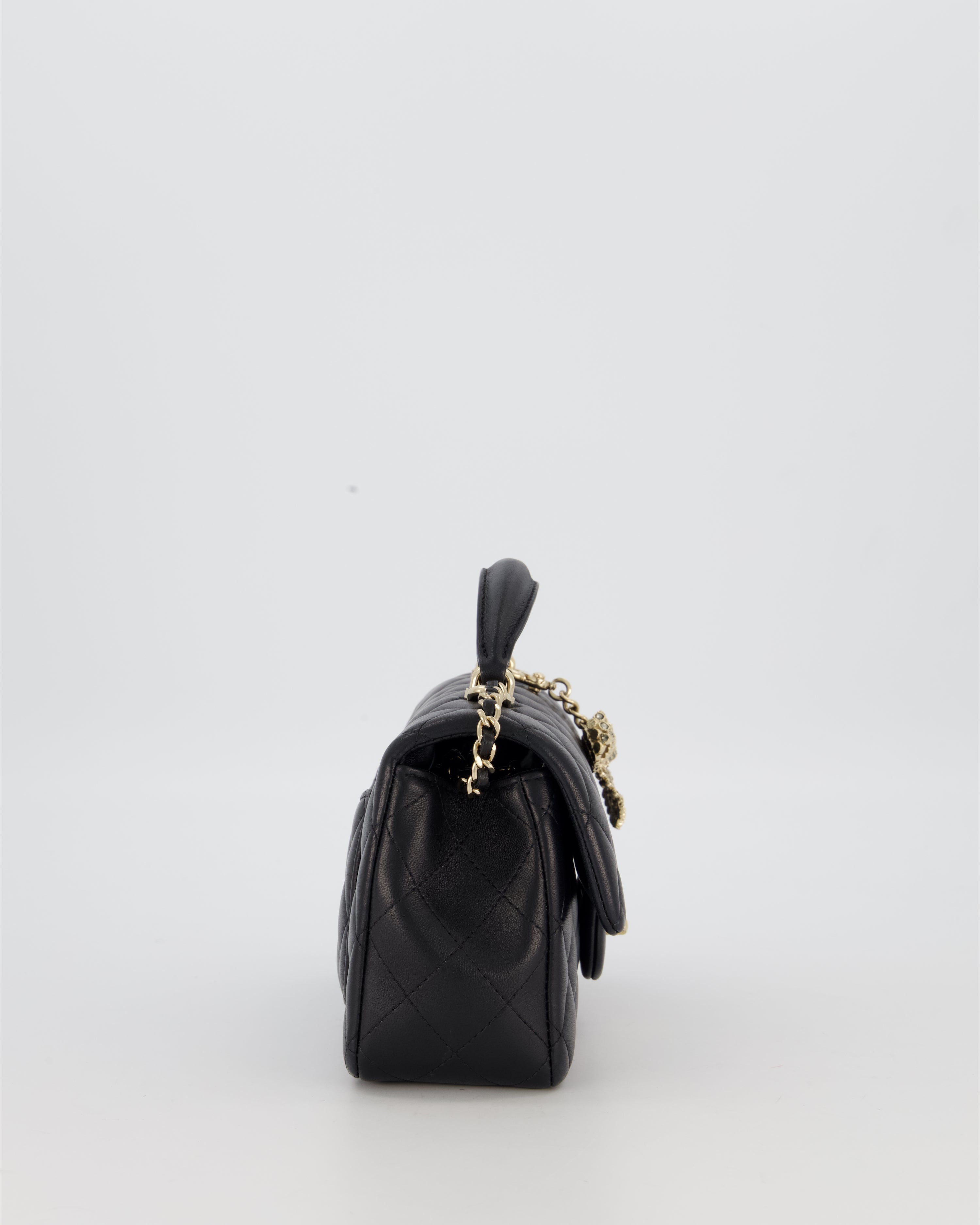 Chanel Black Mini Rectangular Top Handle Flap Bag in Lambskin Leather with Champagne Hardware and Strass Removable Bow Charm