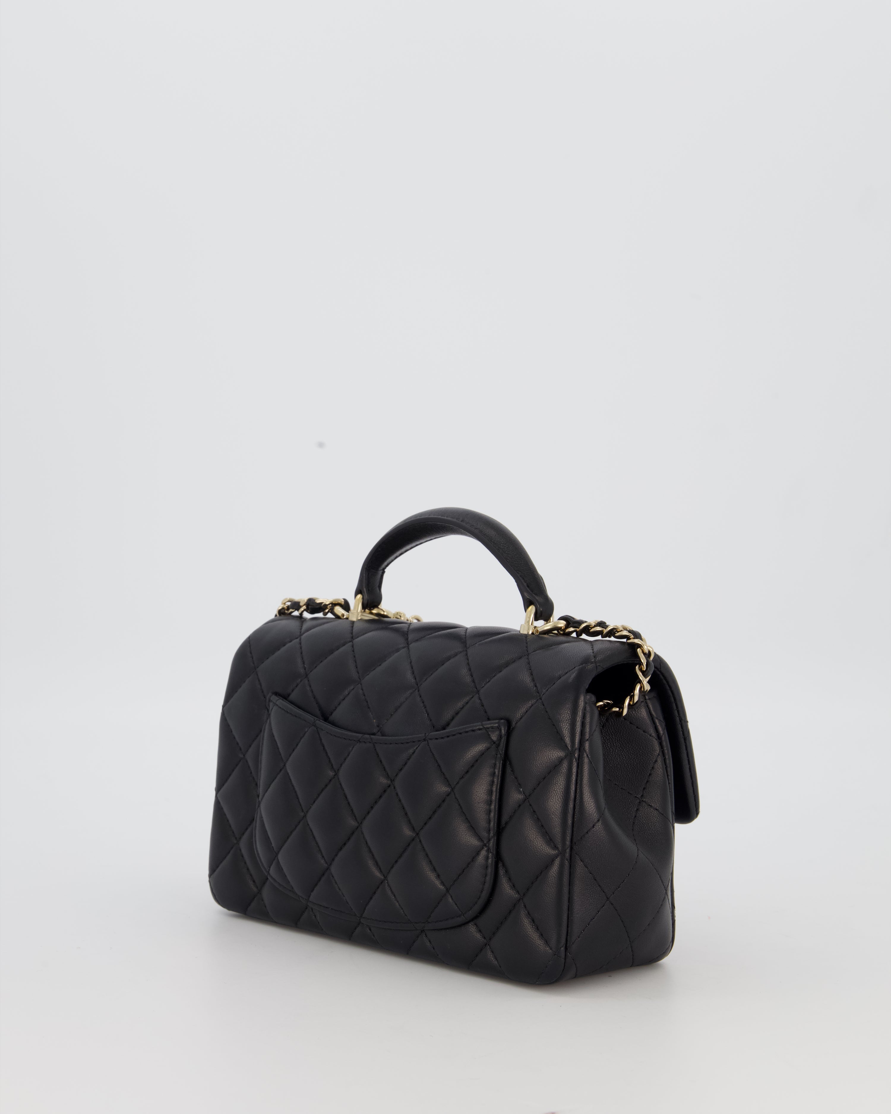Chanel Black Mini Rectangular Top Handle Flap Bag in Lambskin Leather with Champagne Hardware and Strass Removable Bow Charm