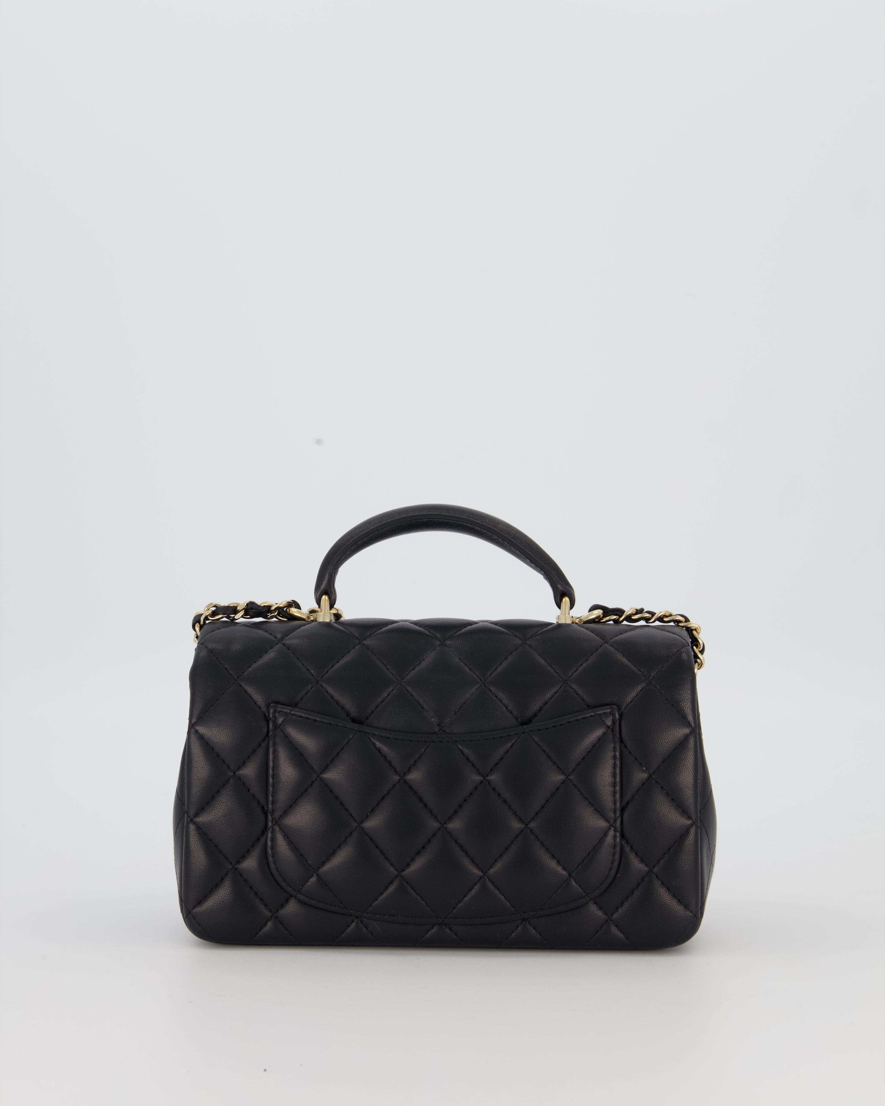 Chanel Black Mini Rectangular Top Handle Flap Bag in Lambskin Leather with Champagne Hardware and Strass Removable Bow Charm